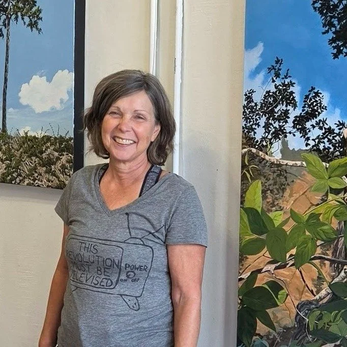 This month, our walls belong to Cindy Taplin (@cintaplin). 🧡

Cindy paints the places around Winston-Salem she loves enough to sit still in &mdash; Salem Lake, the trail, the quiet corners most of us walk past. No people in her paintings, on purpose