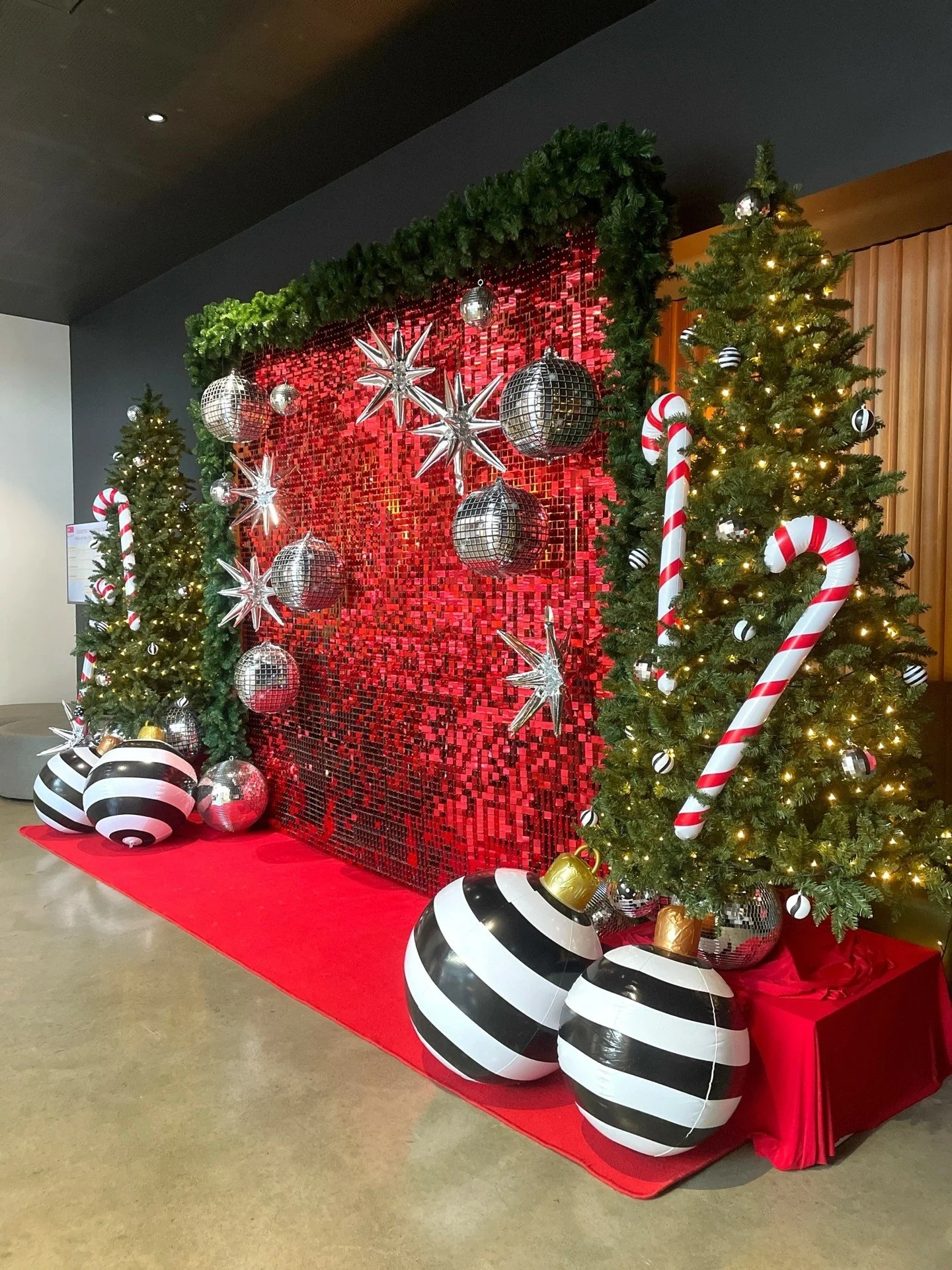Oversized baubles and candy canes with a glam shimmer Christmas backdrop for @unilodgecurtin this festive season.

#designmerchants #eventbackdropperth #Christmasdecor