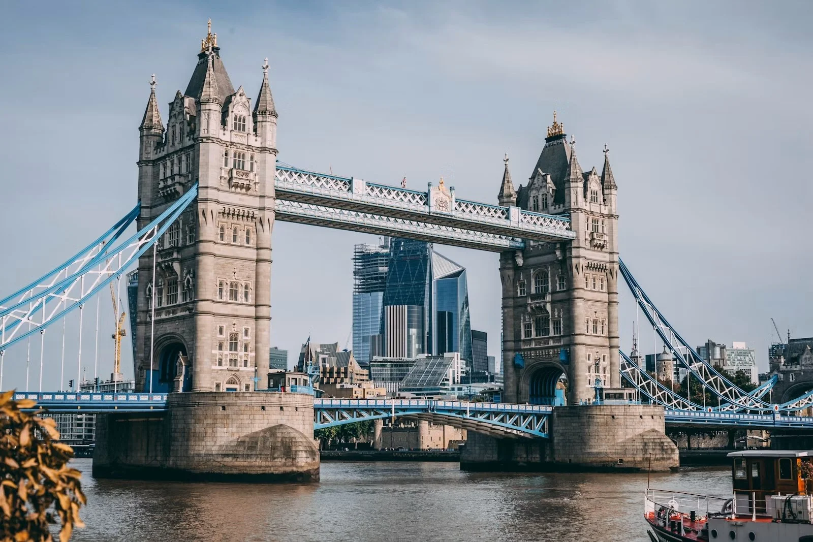 Tower Bridge with the City of London skyline behind it.