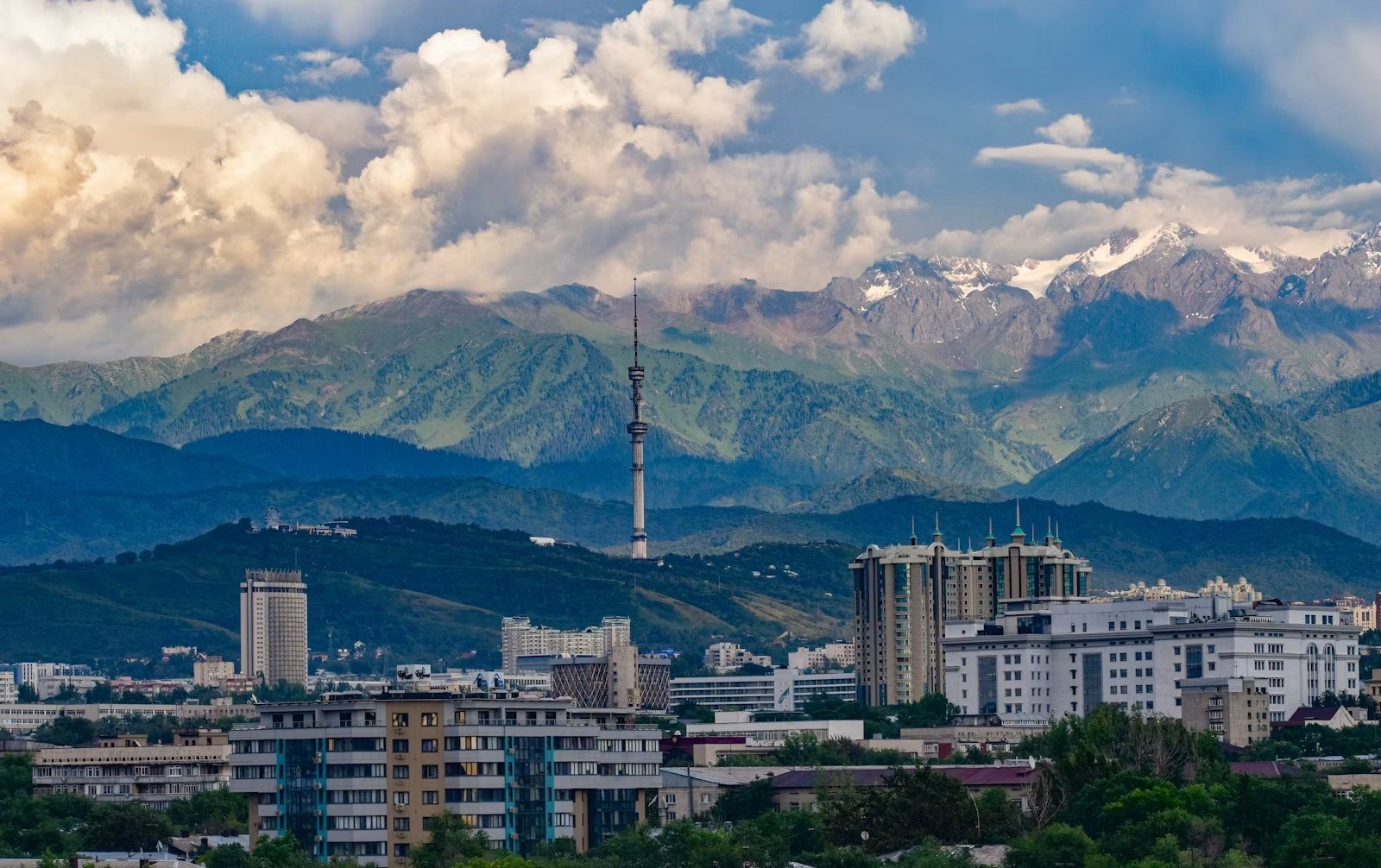 Almaty, Kazakhstan, with snow-capped mountains behind the city.