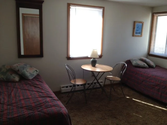 The kid's bedroom is located downstairs on the left.