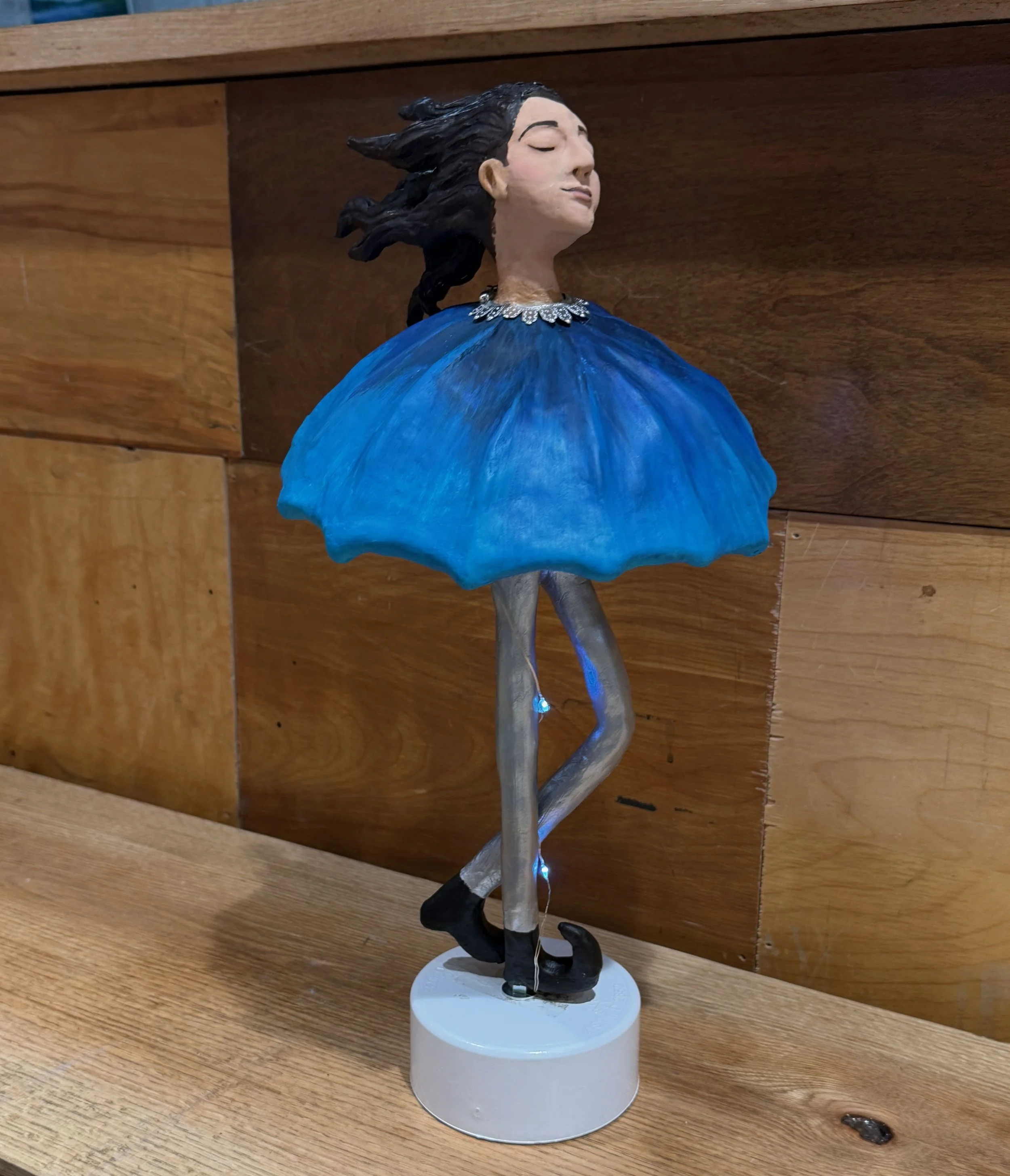 Sculpture of Figure with Umbrella Dress