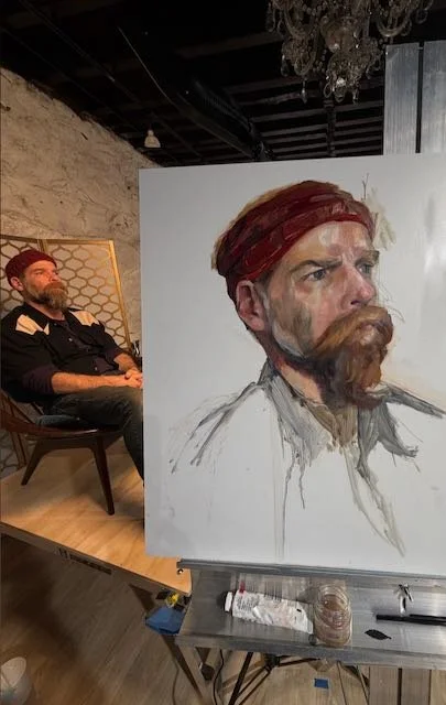 Image of Model posing for portrait and the painting done of him