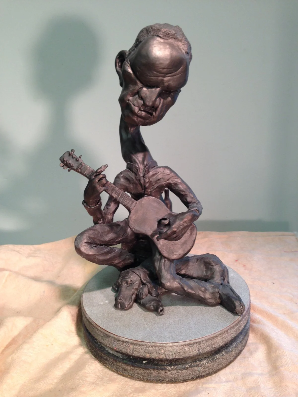 sculpture of a guitar player by Keith Yerger