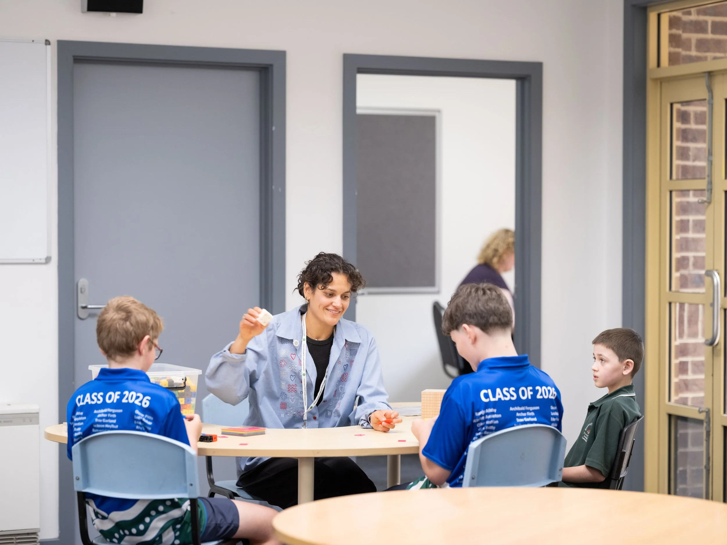 school kids and psychologist interacting