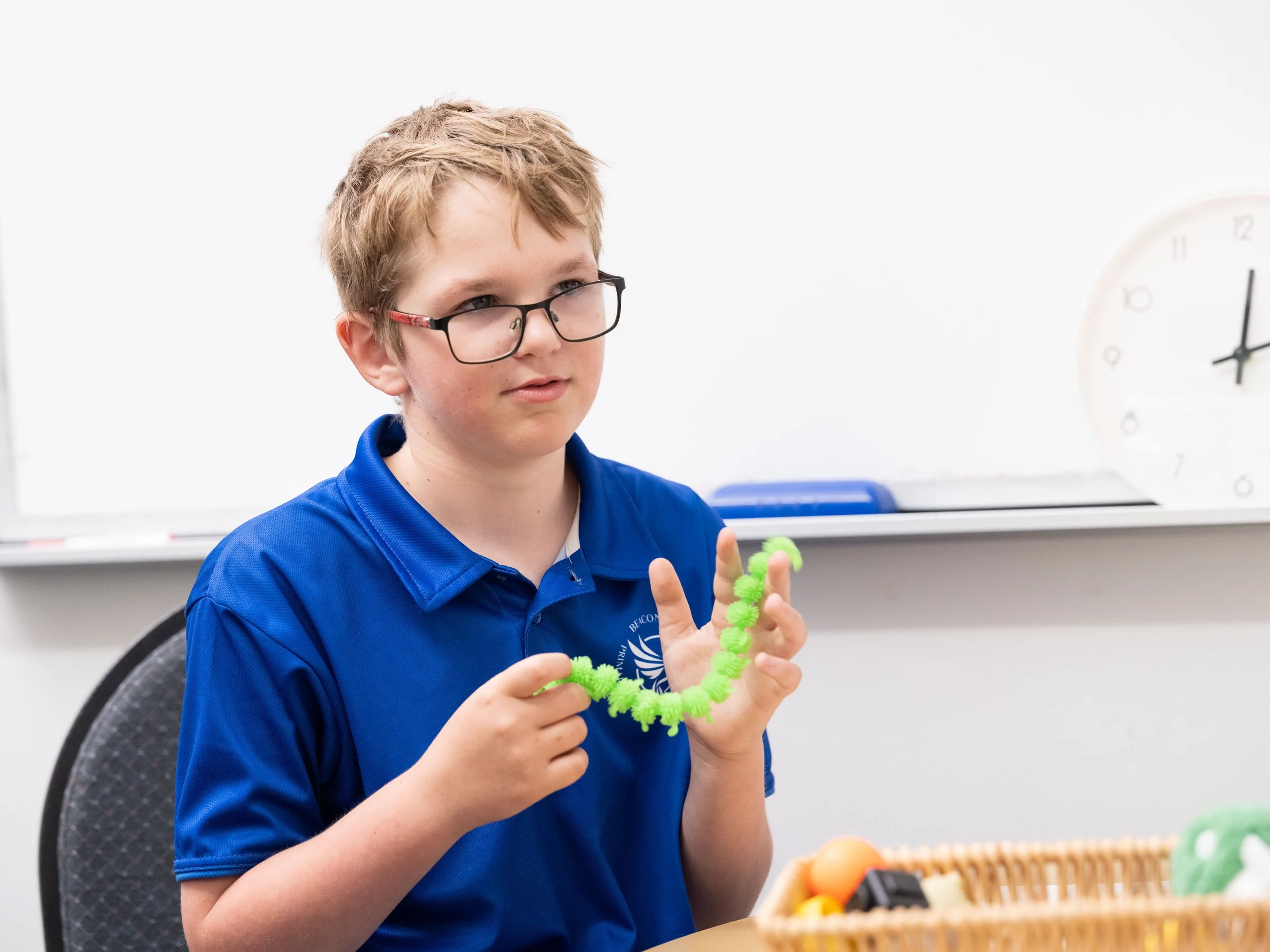 Kid in session with sensory tool