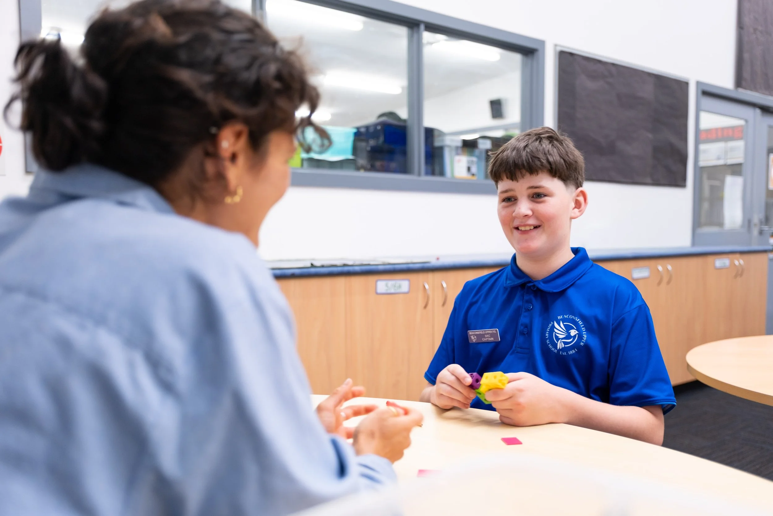 kid at school with teacher