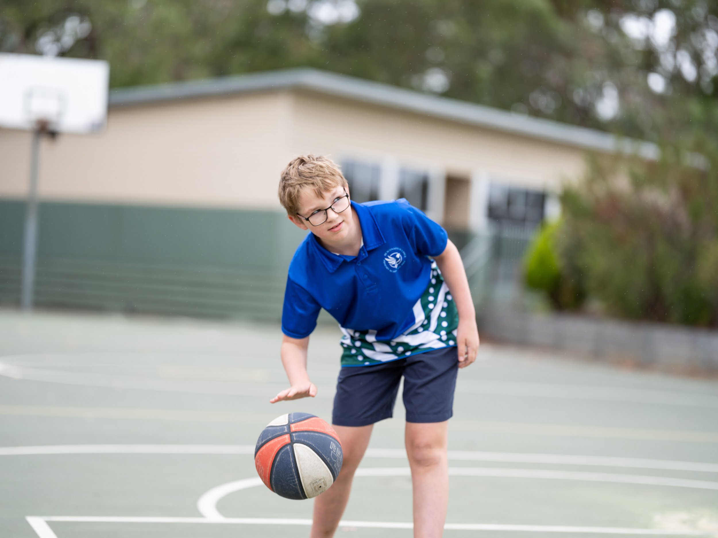 kid playing basketball