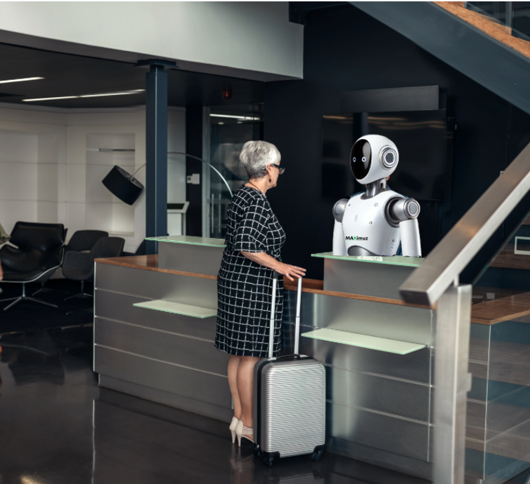 MAXimuz robot assisting a guest at hotel reception desk