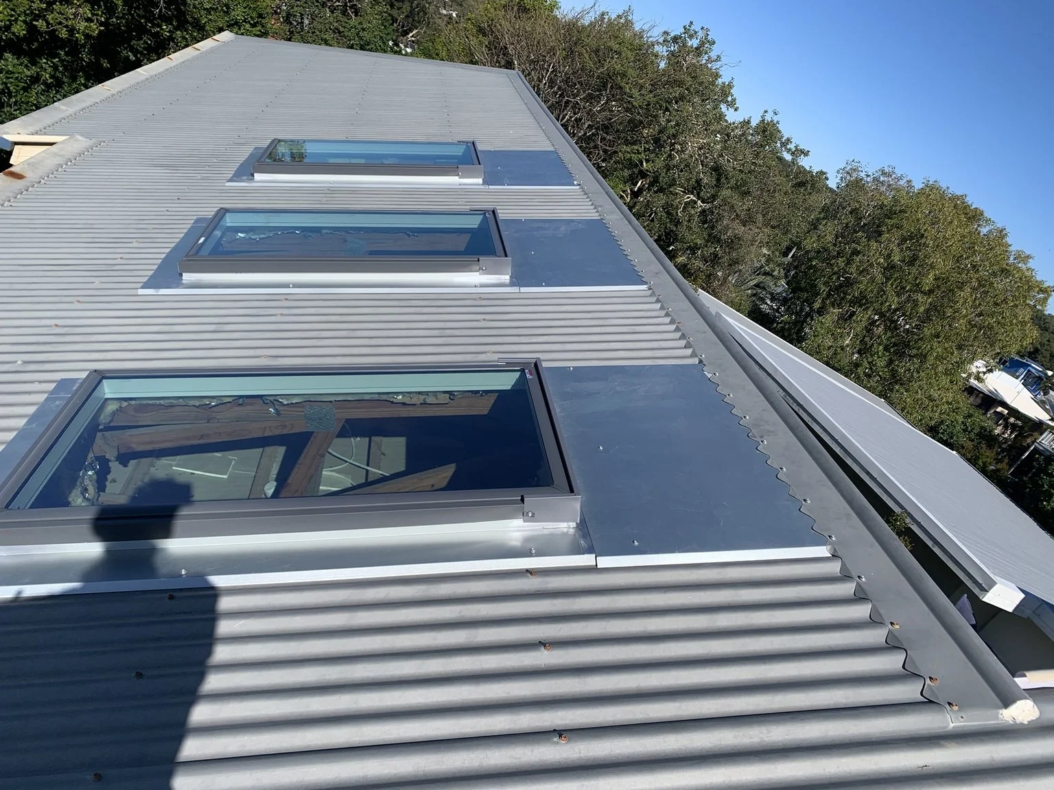 Corrugated metal roof with multiple skylights