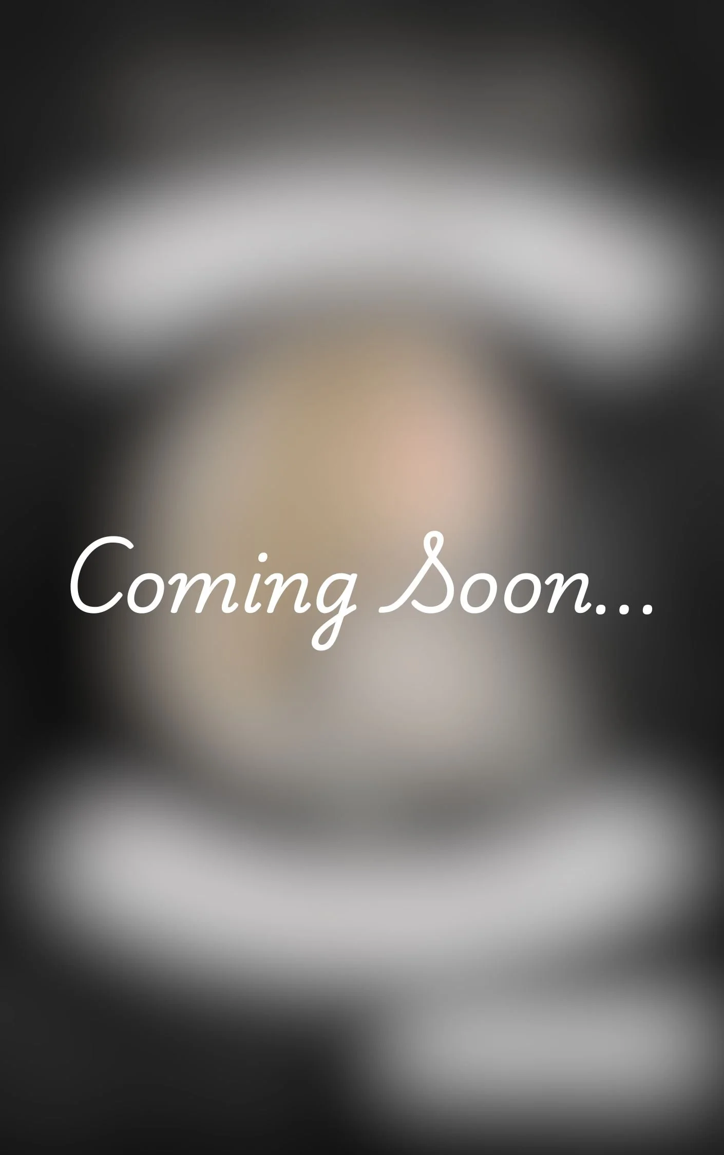 Blurred background with the text 'Coming Soon...' written in white