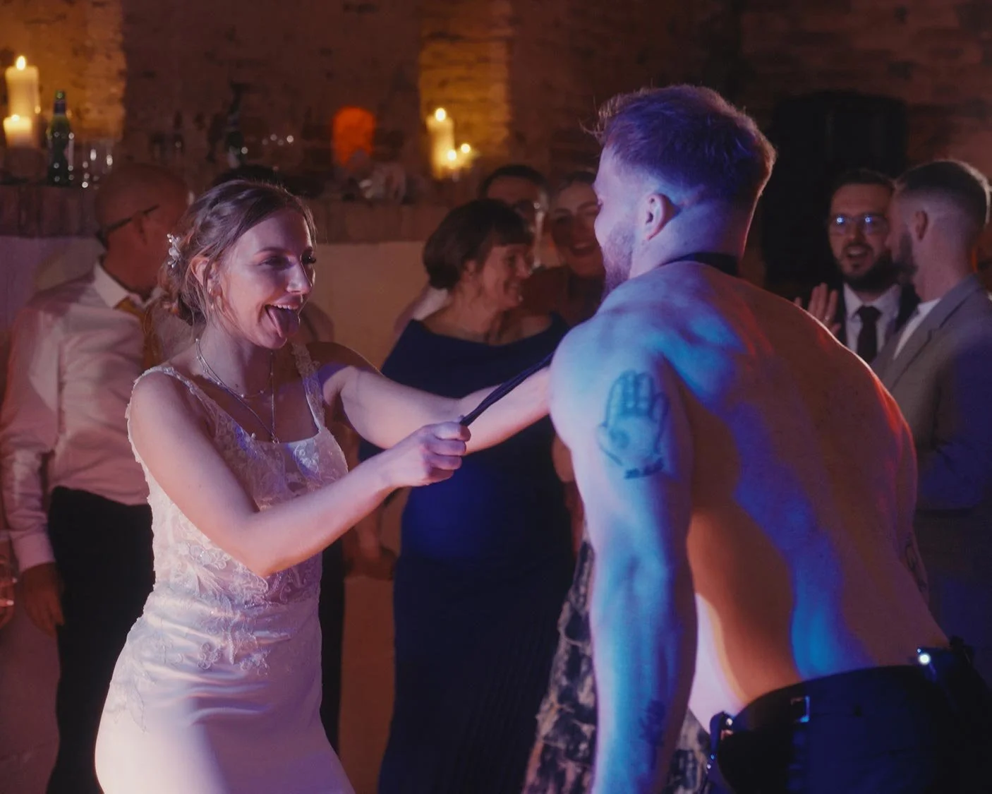 Groom doing a striptease for his bride.
