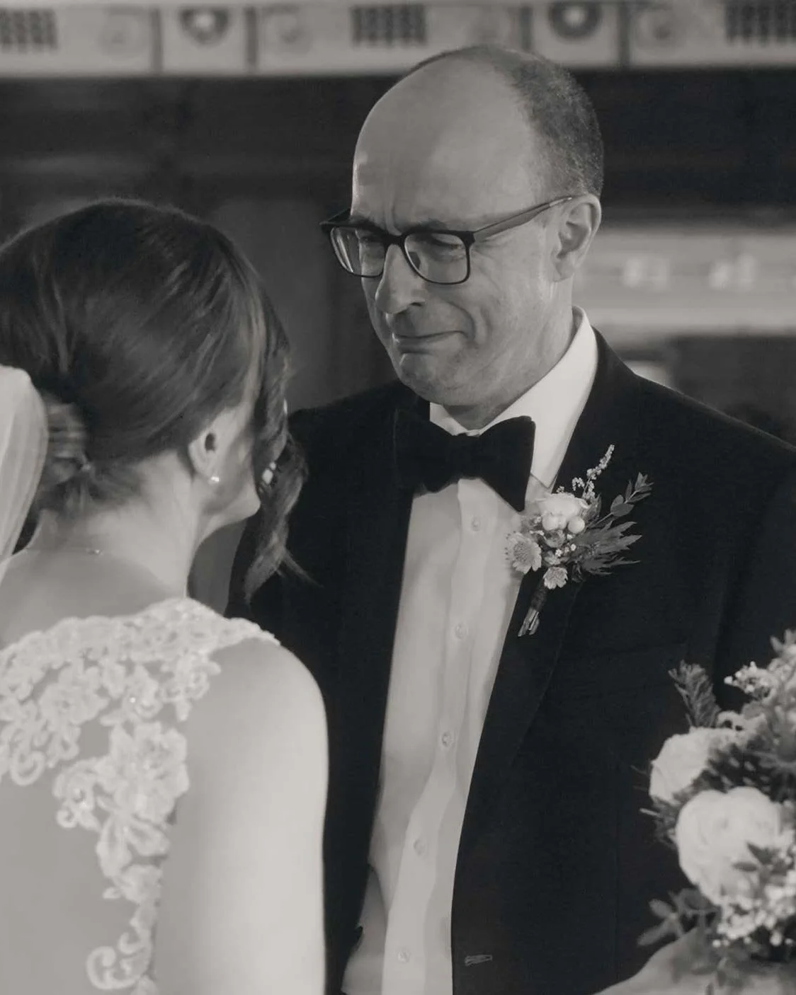 A bride and her father exchanging an emotional gaze. A beautiful moment between father and daughter at a wedding.