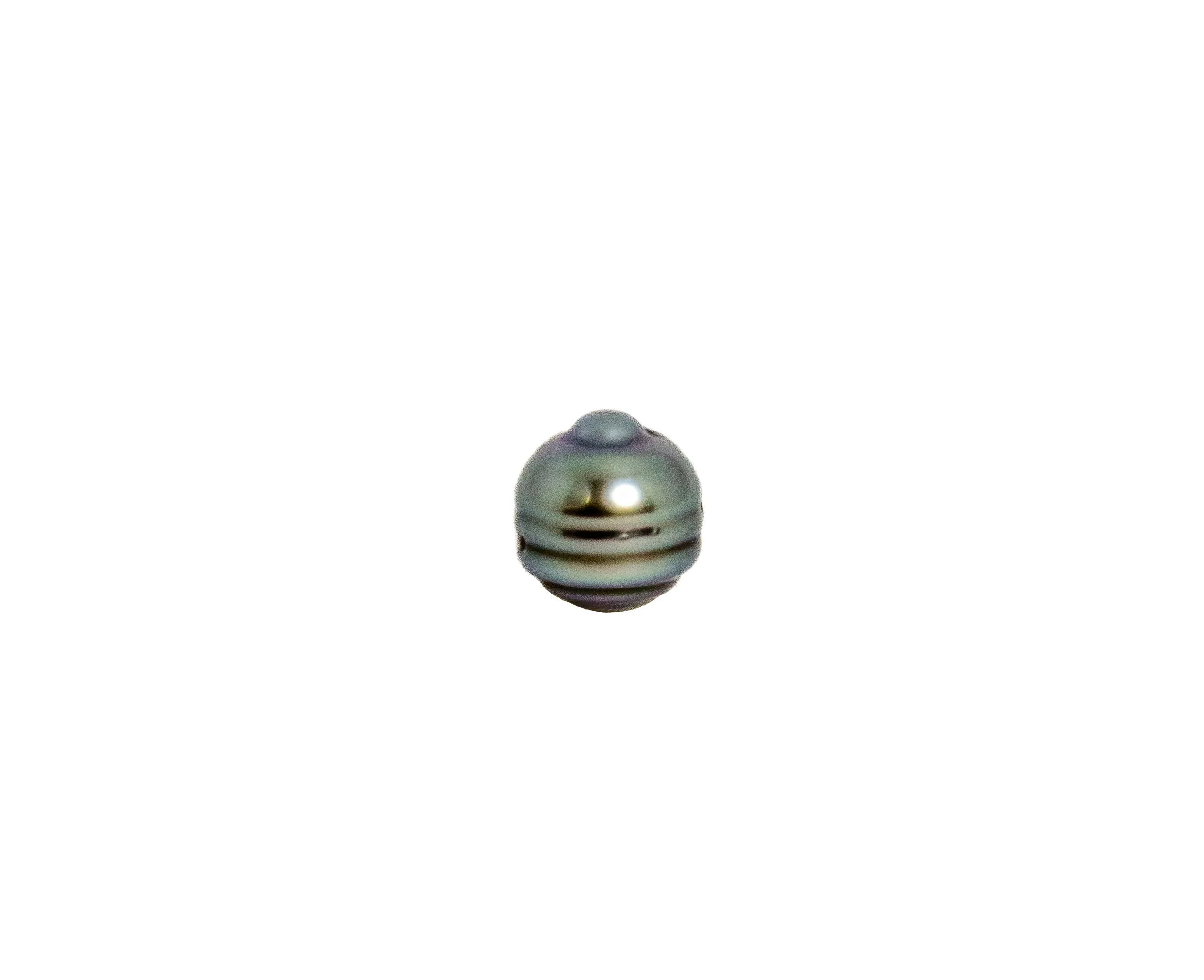 A metallic bead with black and white stripes, small and round, placed against a white background.