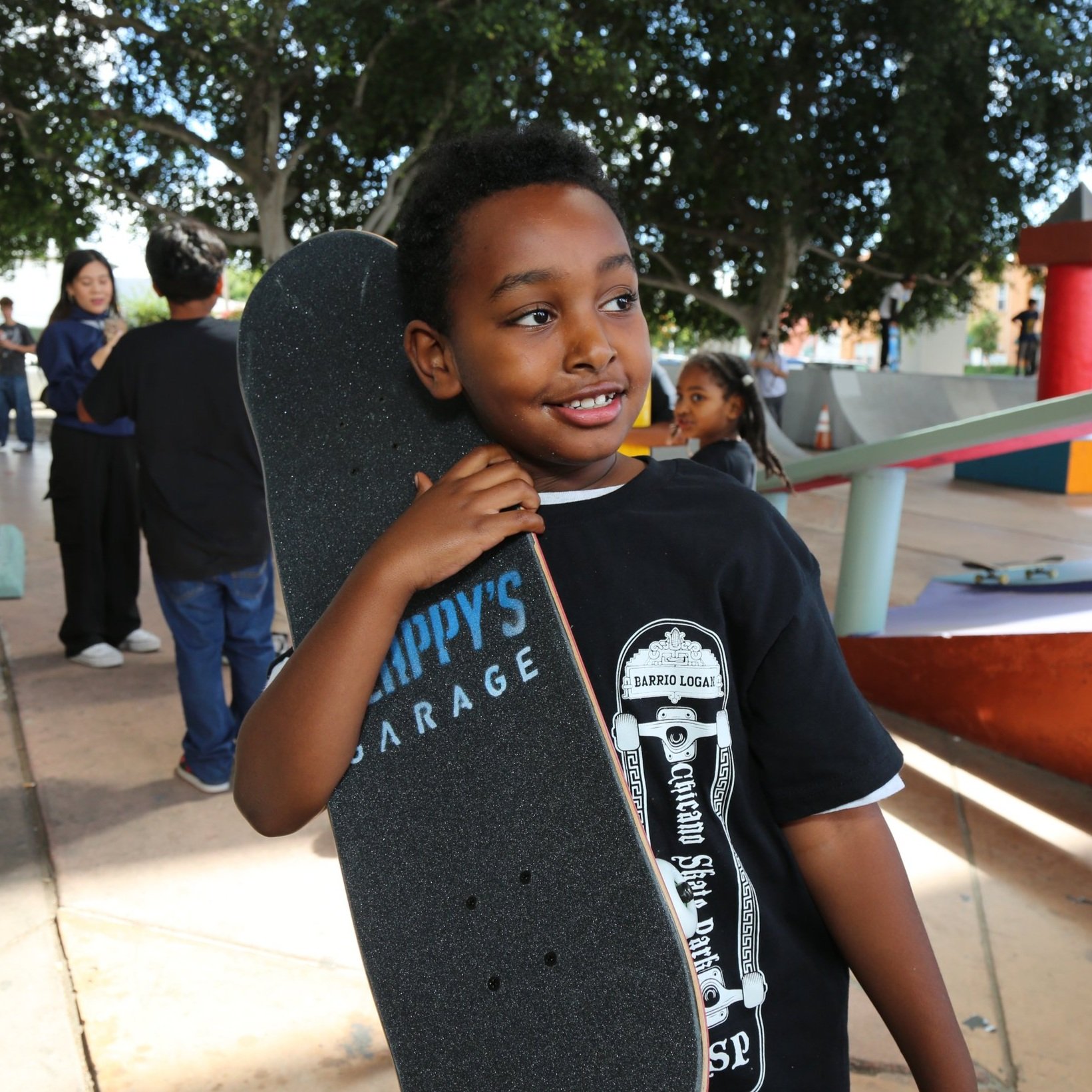 Boy skateboarding at Chicano Park Skatepark in San Diego, highlighting youth urban culture and community space.