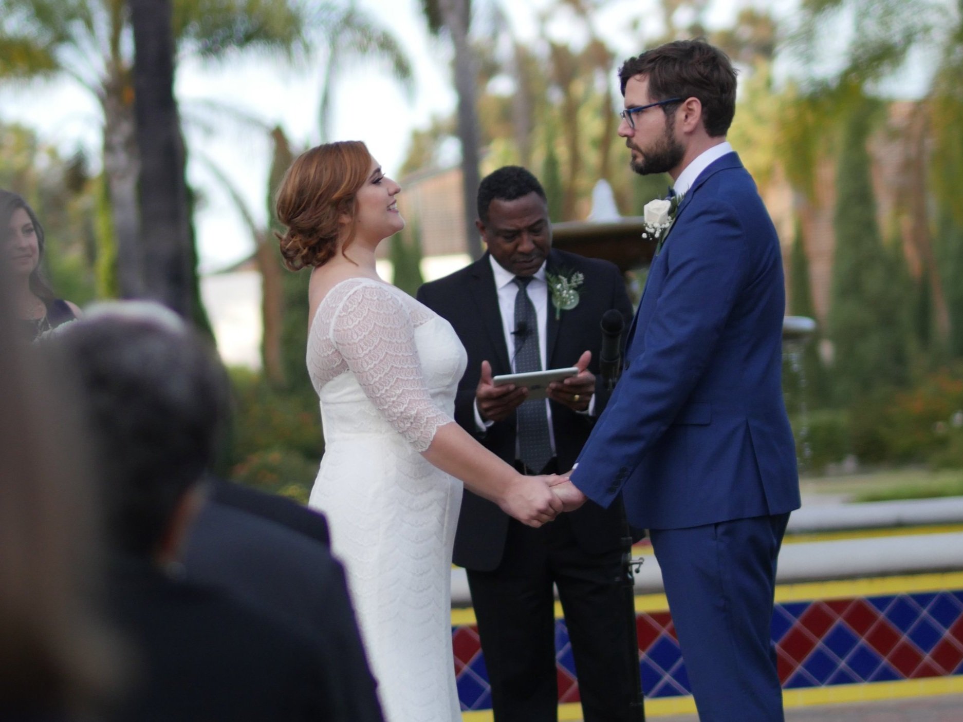 Happy couple smiling at each other during their wedding ceremony in San Diego, capturing a joyful moment of love.