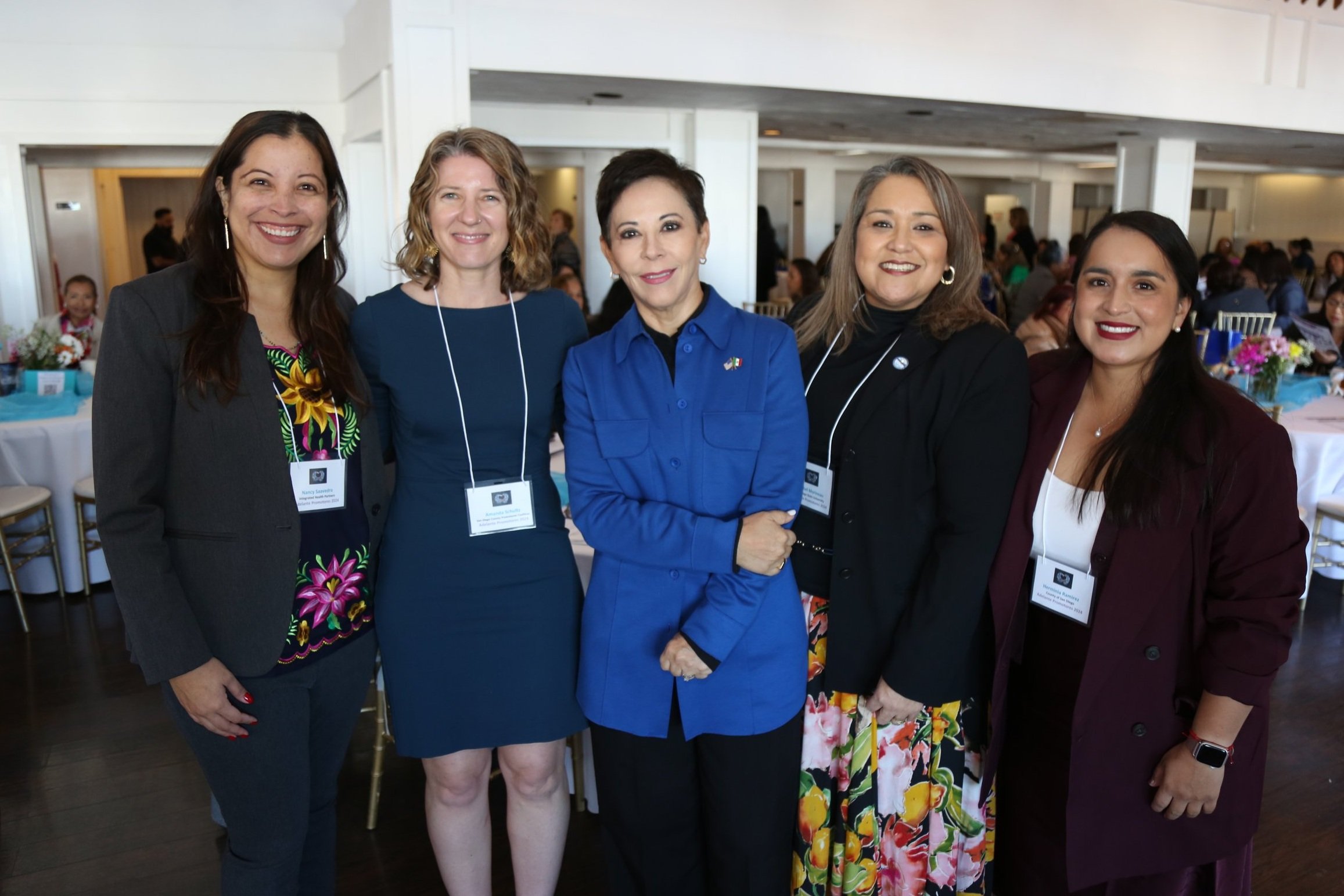 Group of Latina women participating and socializing at a community event in San Diego.