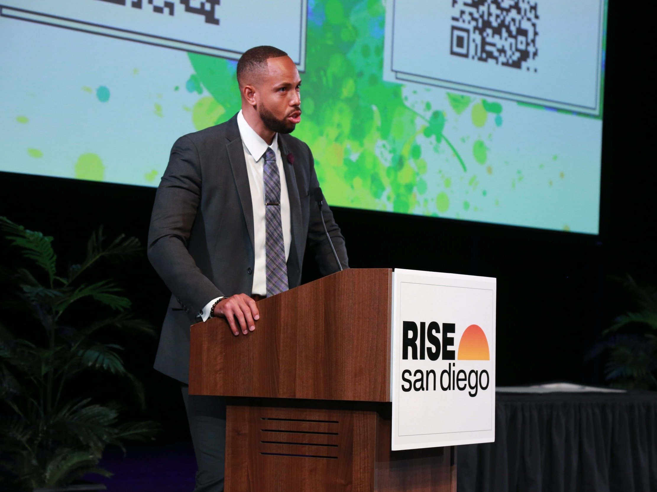 Speaker delivering a keynote at the RISE San Diego corporate networking event, engaging the audience in downtown San Diego.