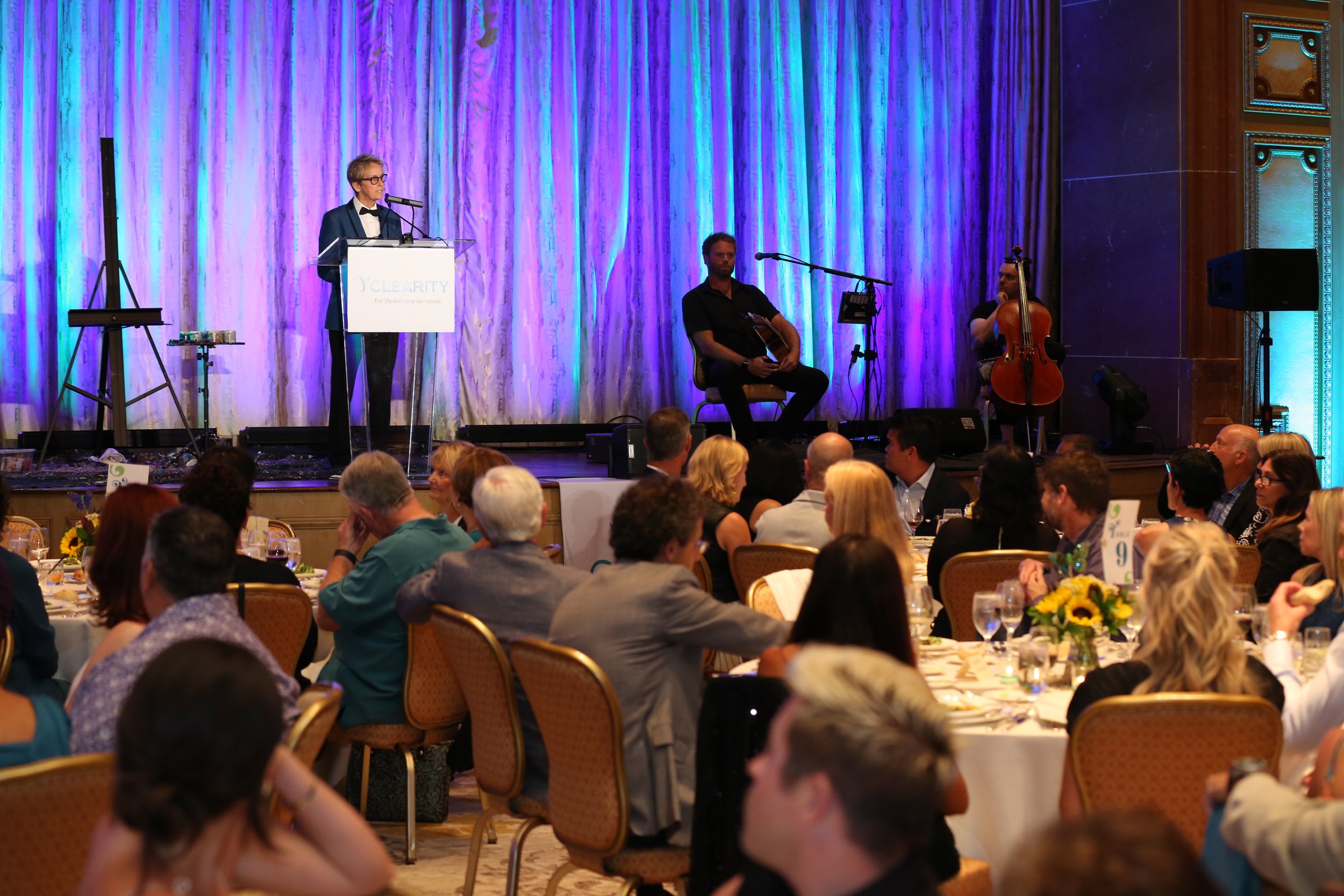 Speaker addressing attendees at the Clearity Foundation gala in San Diego, supporting ovarian cancer research and awareness.