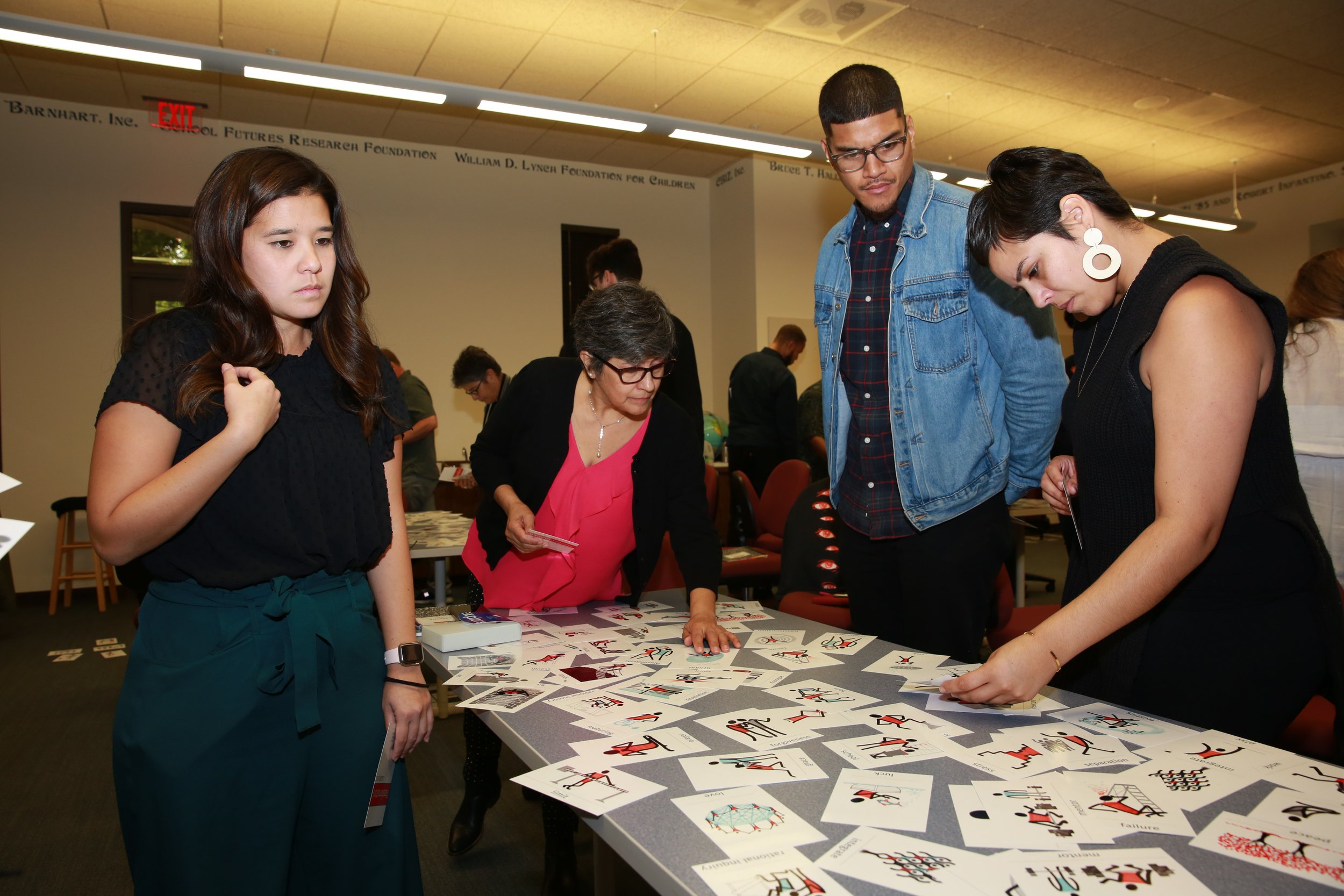 Participants at the RISE San Diego annual workshop, engaging in skills training and community development activities.