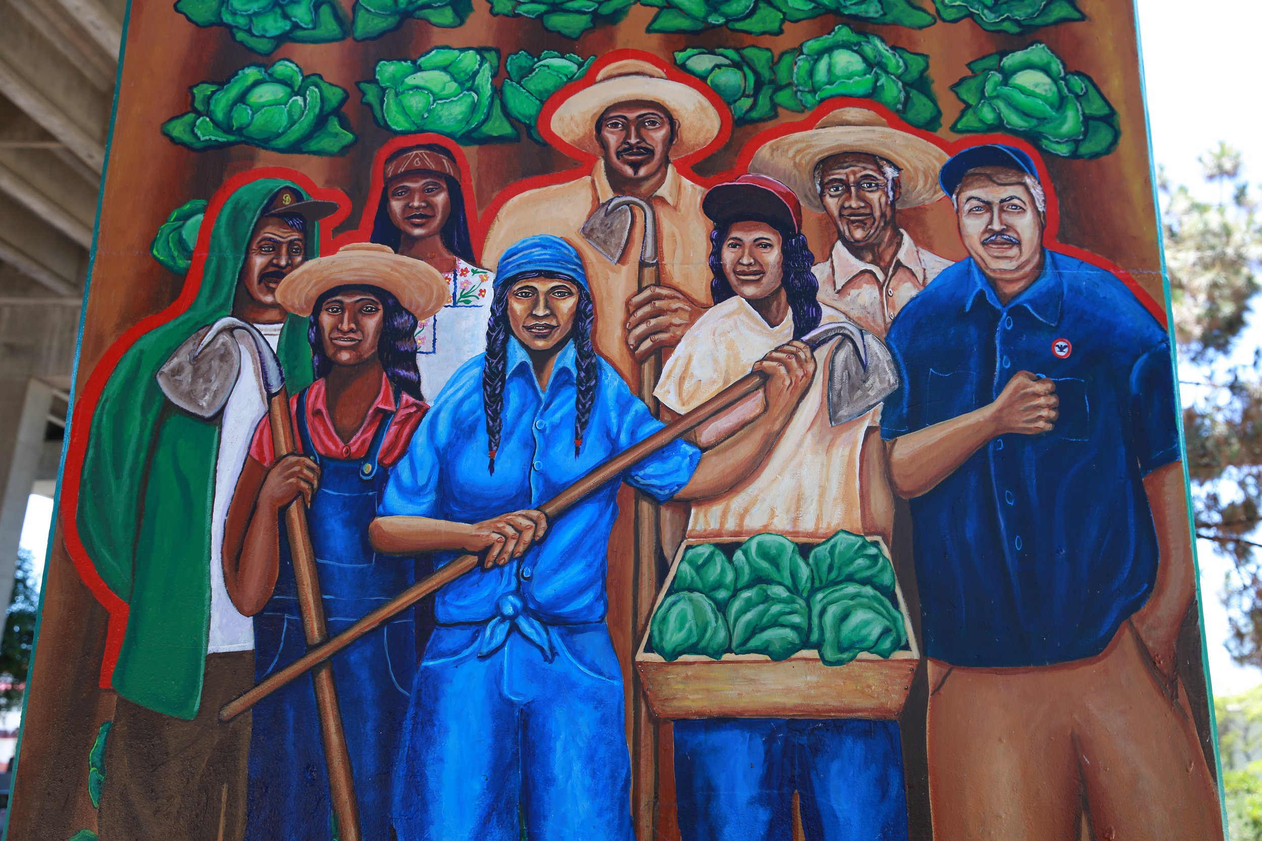 Mural of farmworkers at Chicano Park in San Diego, celebrating agricultural labor and community history.