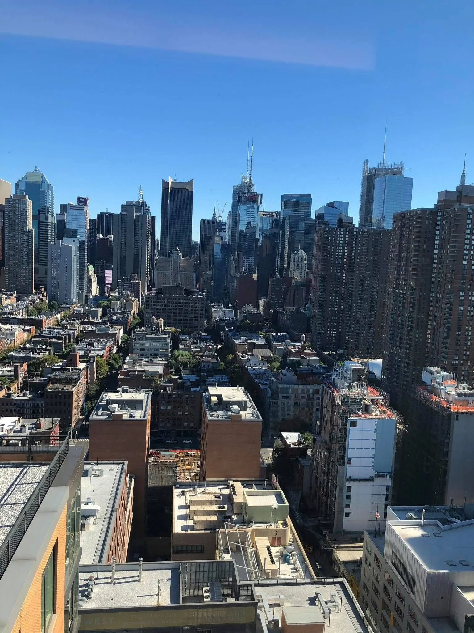 Cityscape of downtown Seattle, Washington, with tall skyscrapers and clear blue sky.
