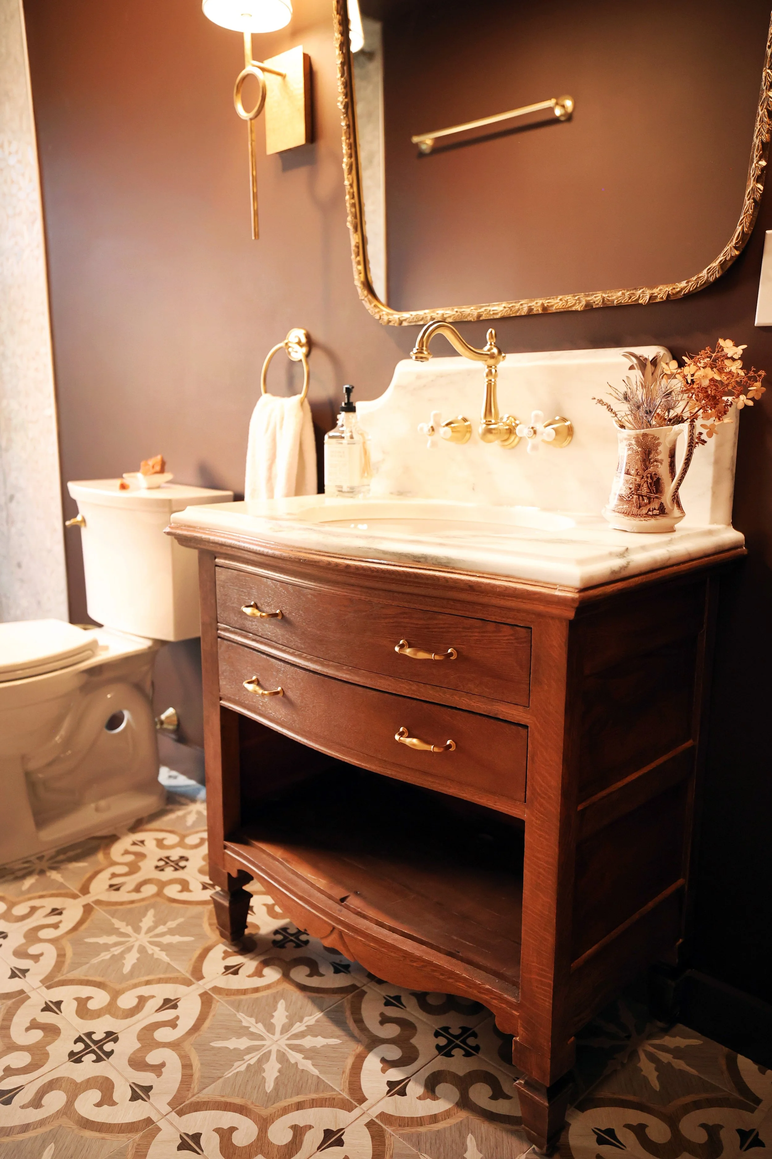 custom dresser to vanity conversion with a customized marble vanity top and wall mounted sink faucet. Vintage and farmhouse style. Designed in Vermont and New Hampshire. The upper valley of new england.