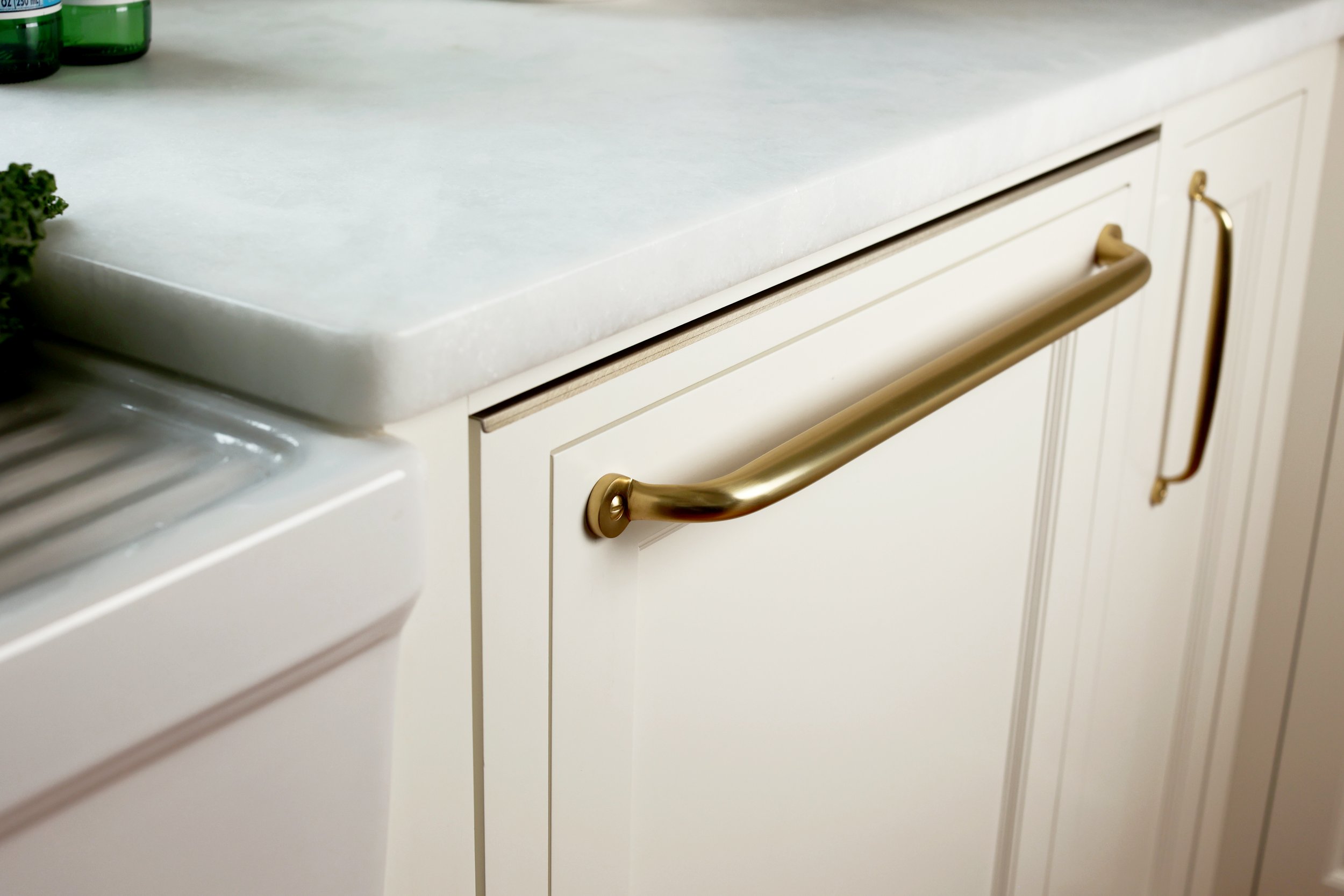 Integrated panel-ready dishwasher concealed within custom cabinetry in a historic Vermont kitchen remodel.