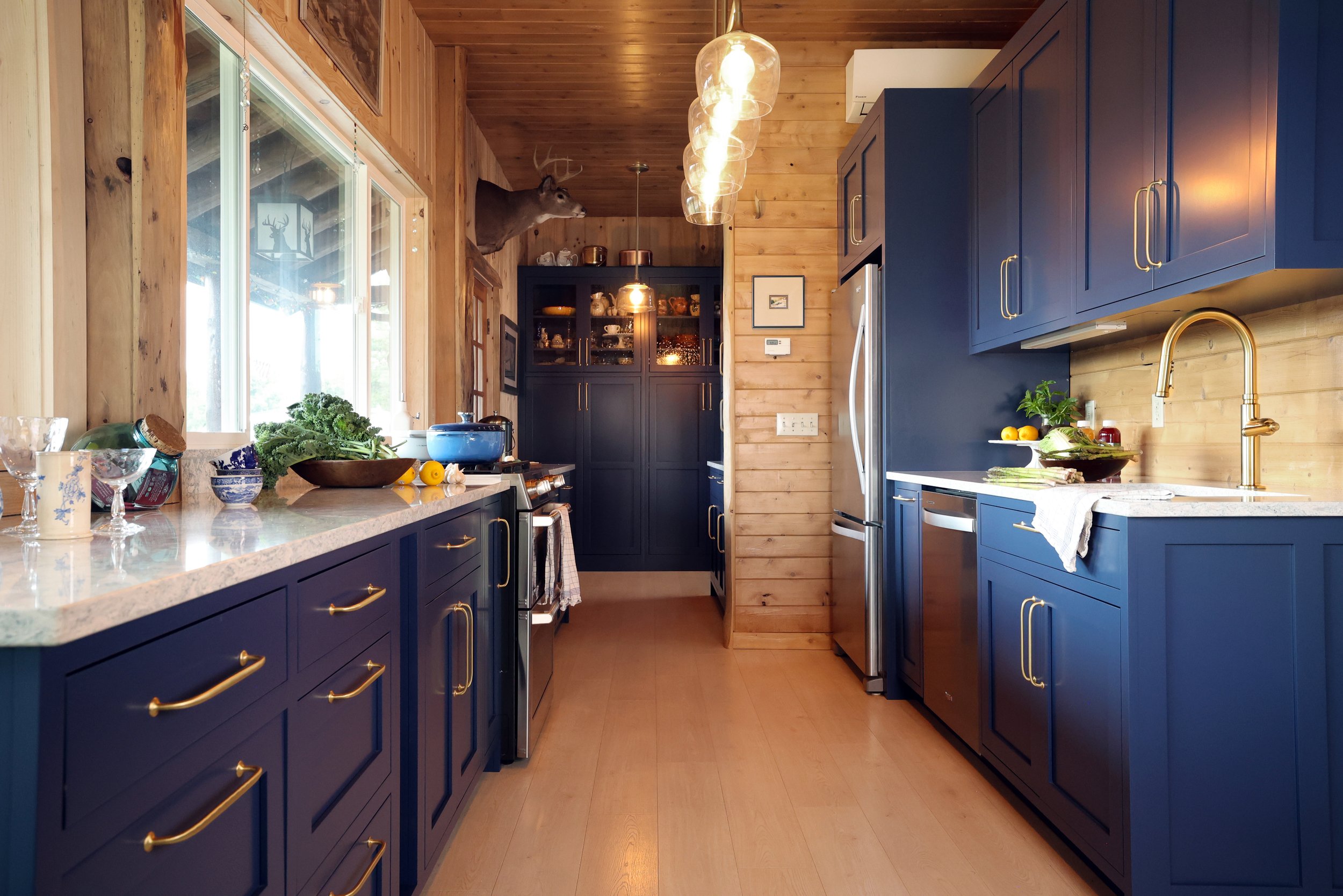 Lodge kitchen with custom Crown Point Cabinetry in a New Hampshire family retreat.