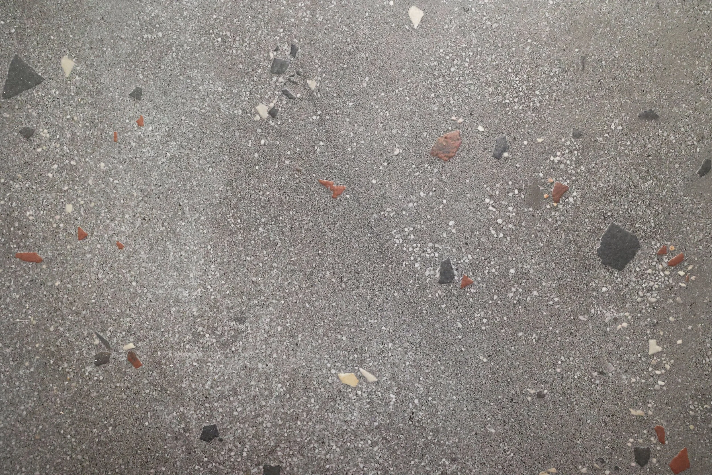 Cement terrazzo tile flooring detail in a Northeast Kingdom Vermont ski home bathroom.
