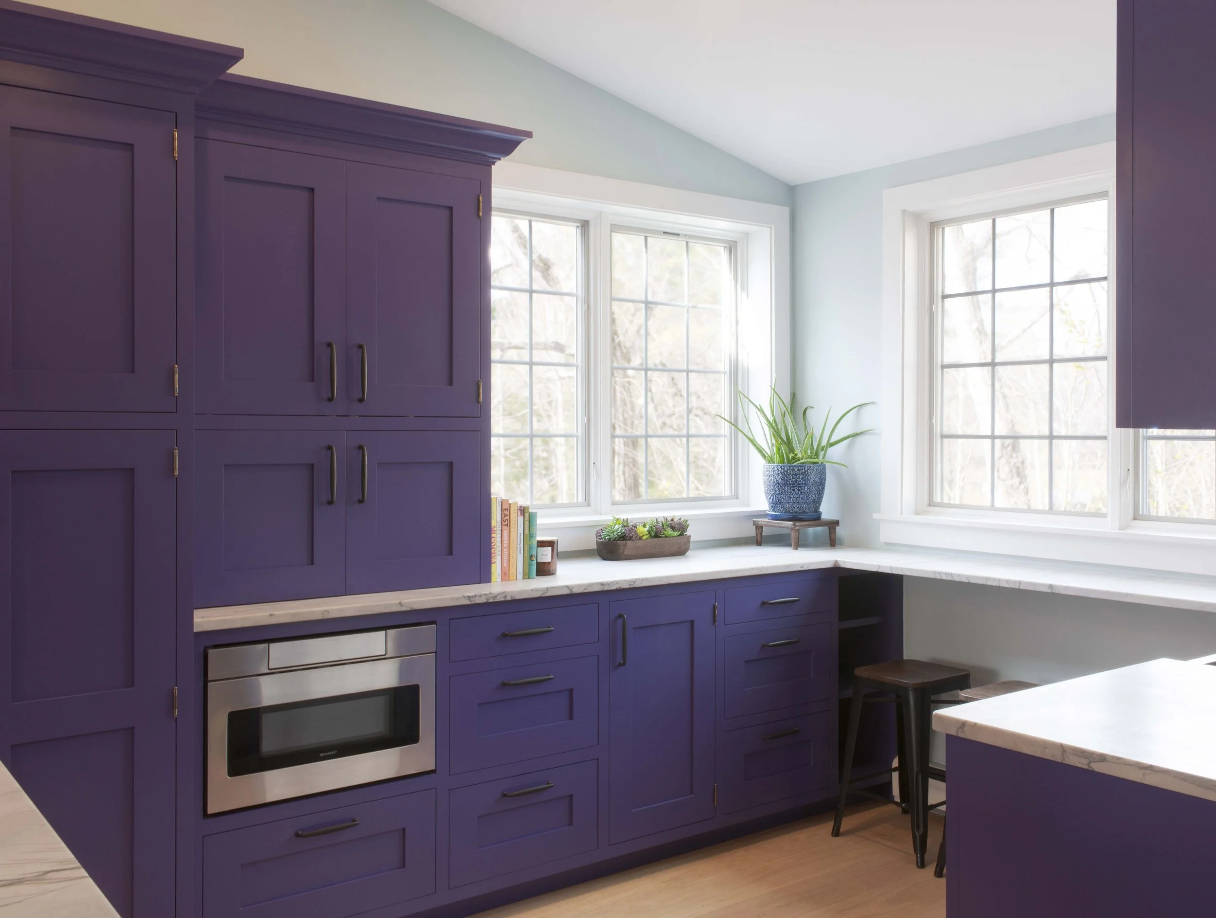 Sharp microwave drawer integrated into custom Crown Point Cabinetry in a Norwich Vermont kitchen.
