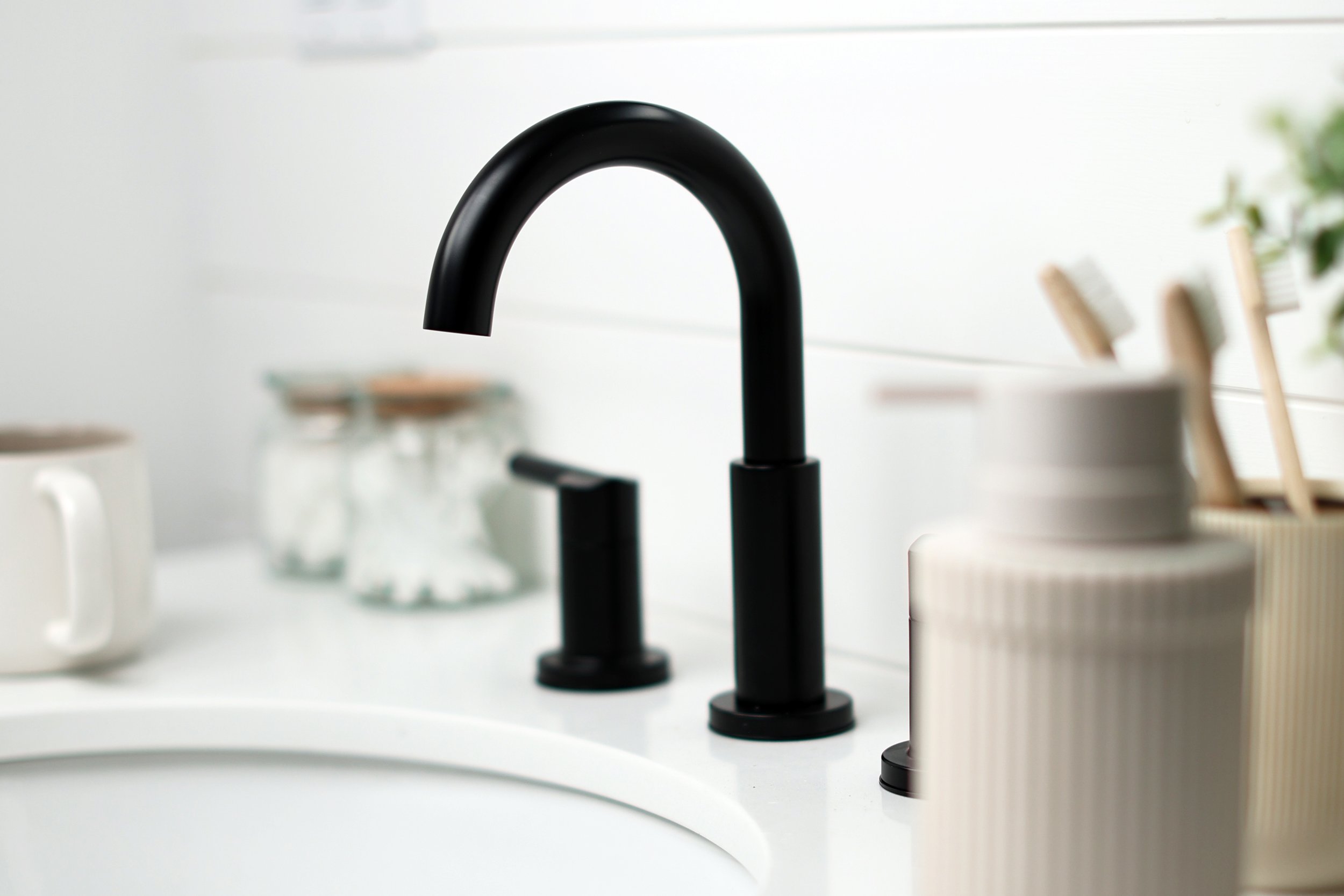 Matte black Kohler faucet close-up in a modern ski house bathroom in the Northeast Kingdom of Vermont.
