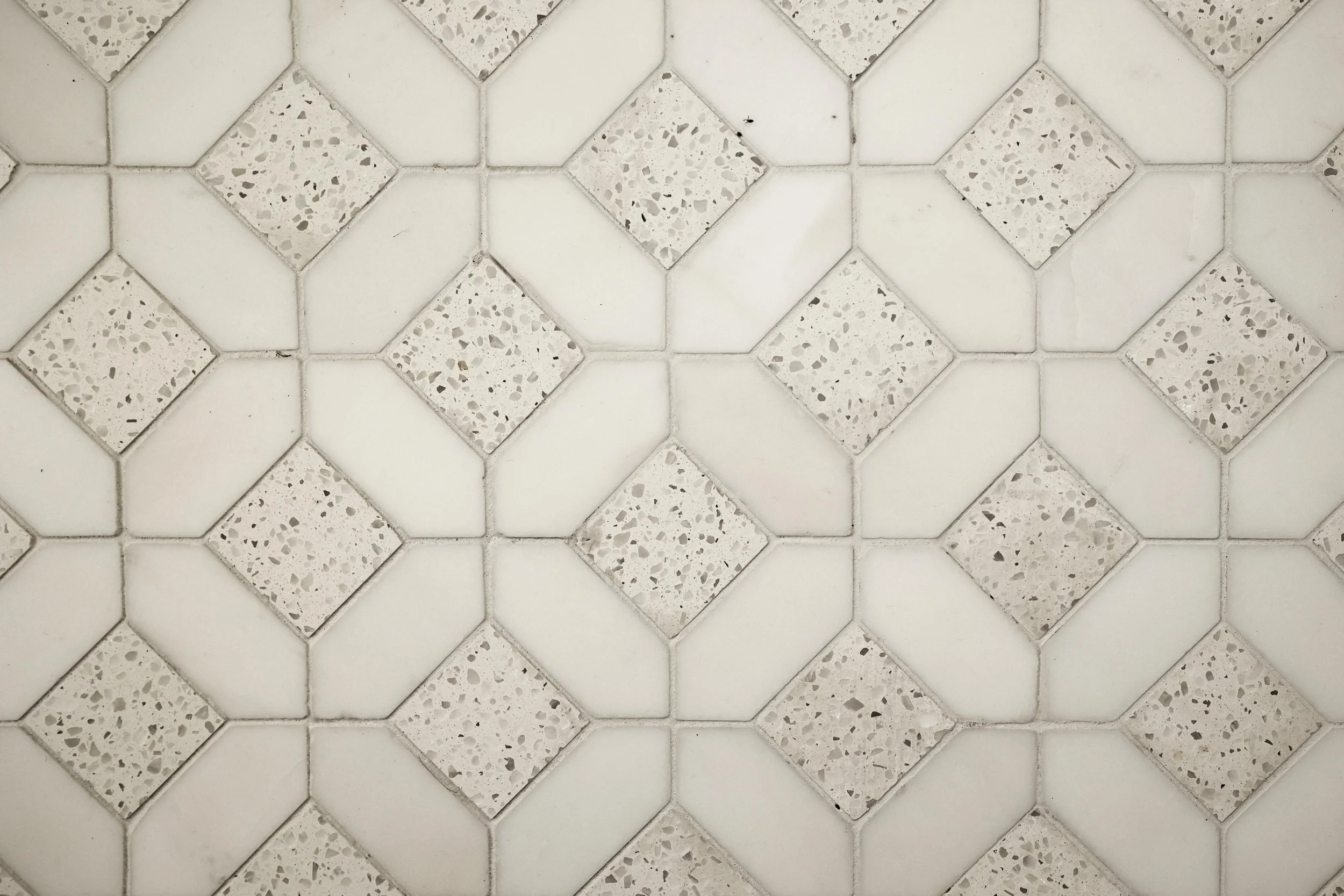 White terrazzo mosaic floor detail in Hanover NH primary bathroom renovation