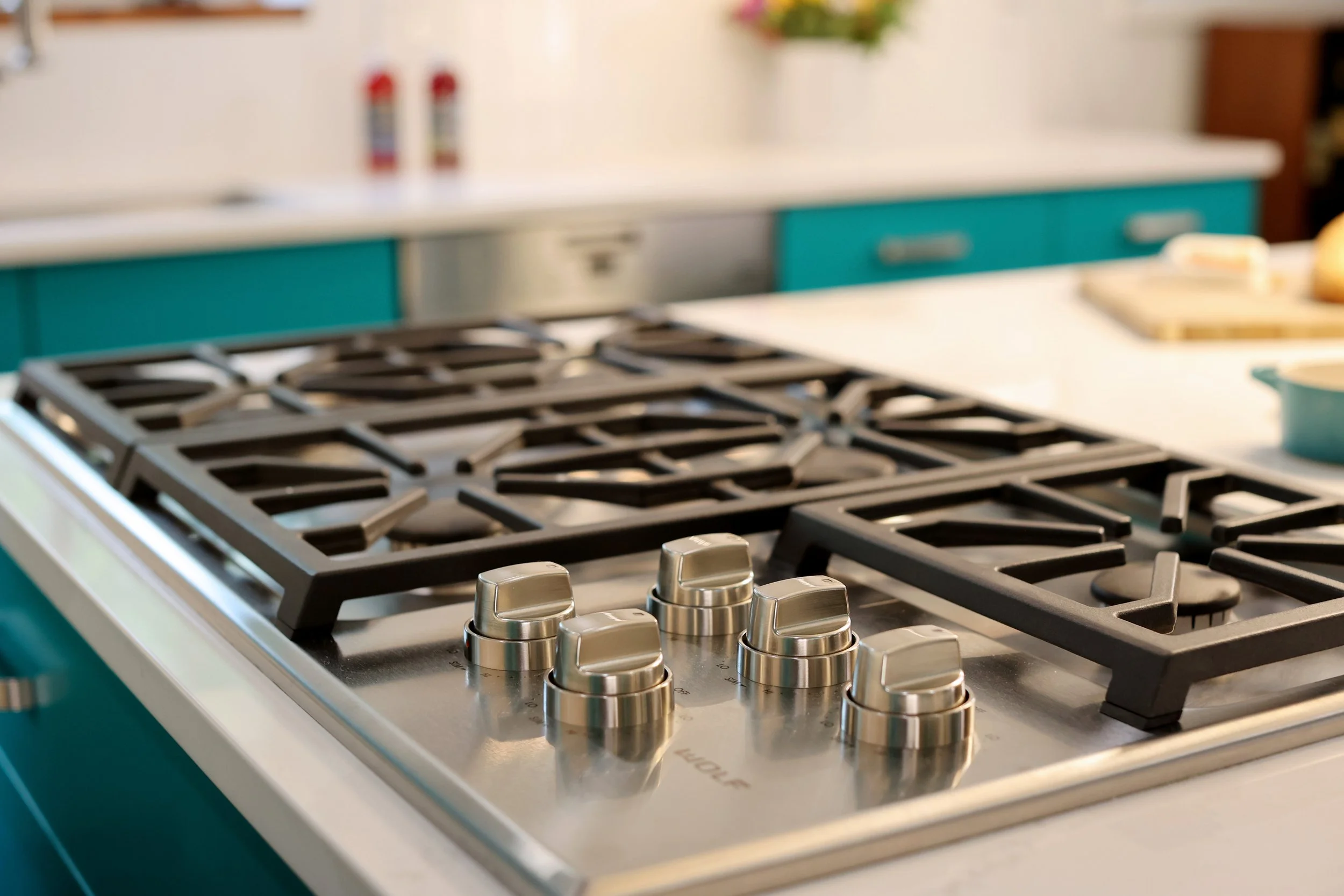 Wolf gas range detail in a colorful midcentury kitchen in White River Junction Vermont.