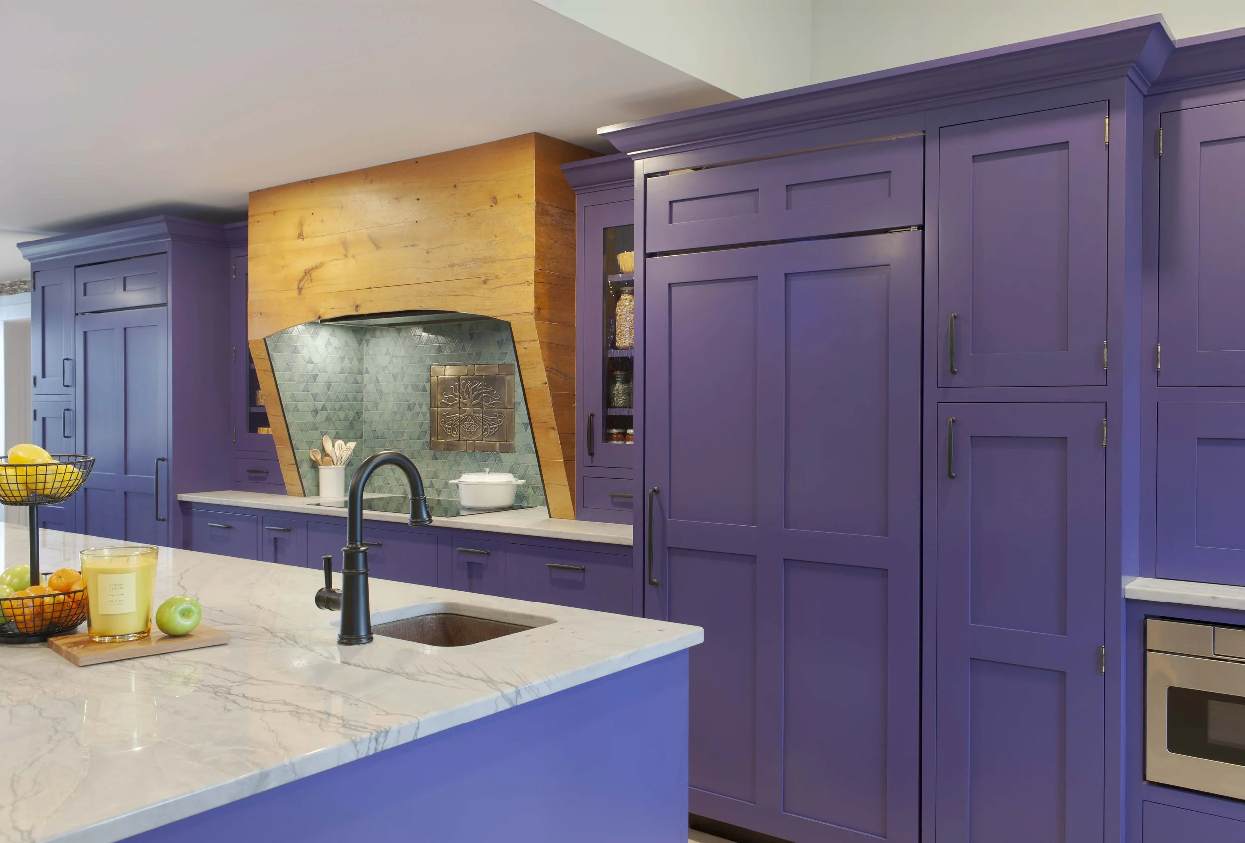 Kitchen in Norwich Vermont with Crown Point Cabinetry painted Sherwin Williams Fully Purple and Maldive Quartzite countertops.