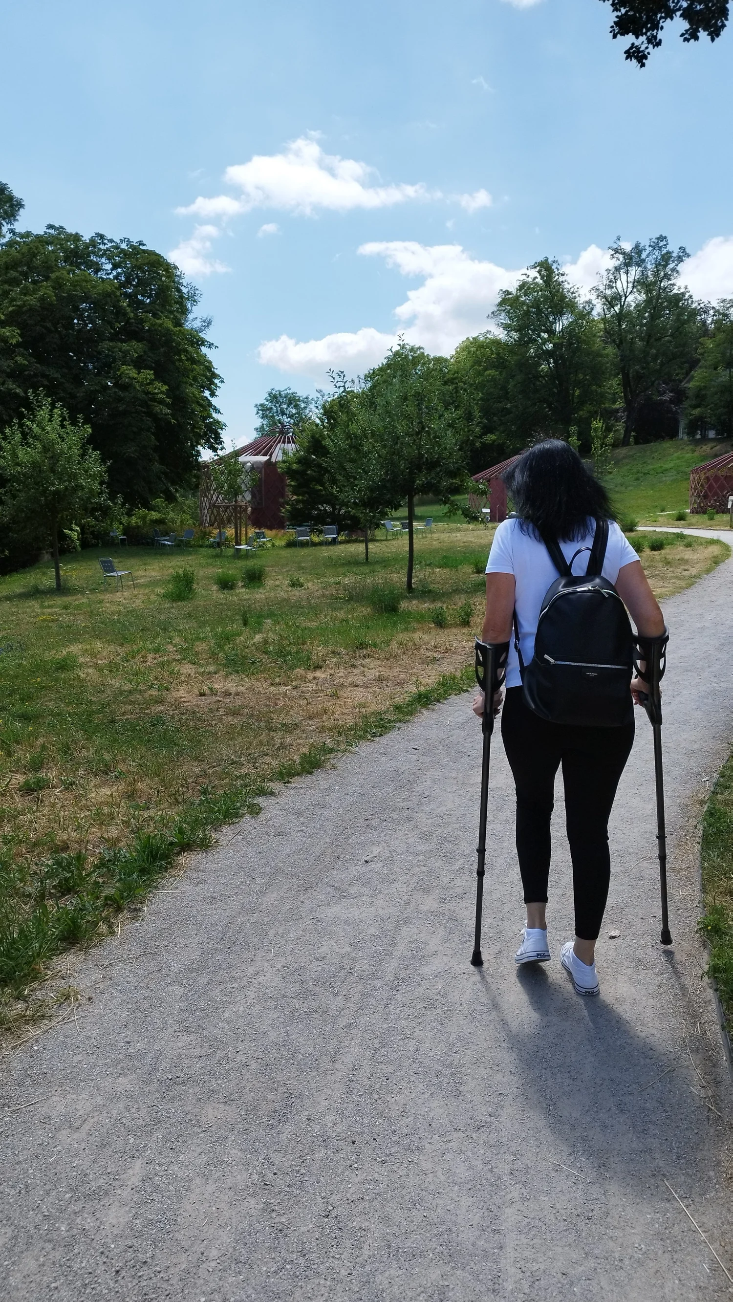 Tanja’s mother walking outdoors with crutches