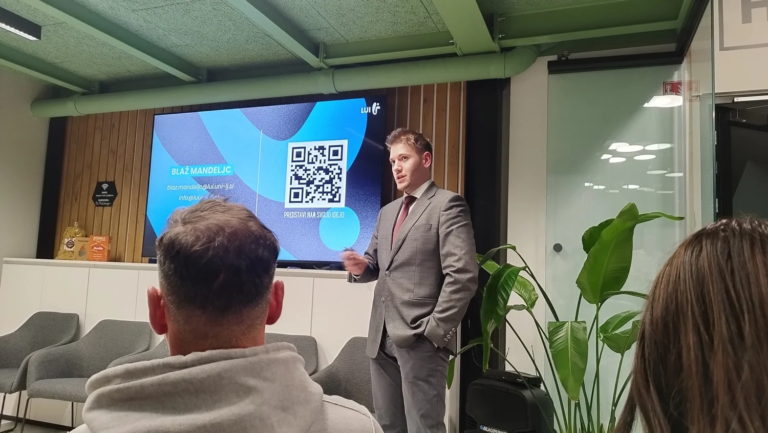 A speaker presenting at a social-impact event