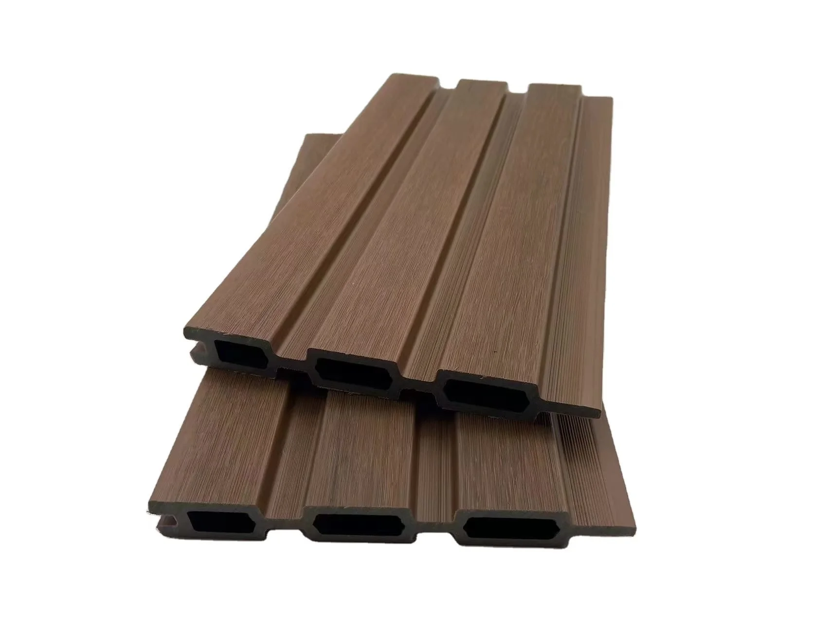 Two brown composite decking boards with a wood-grain texture, viewed from an angle, on a white background.