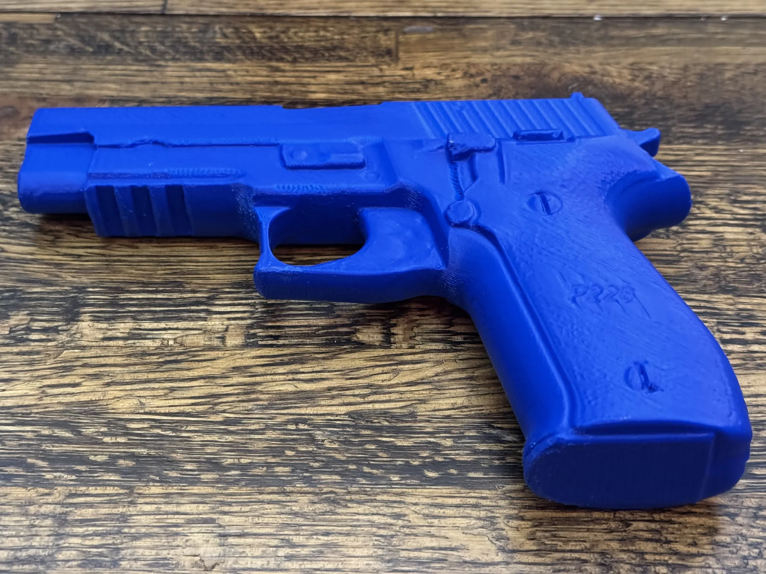 Sig Sauer P226 MK25 physical replica, non-functional inert training pistol for safe handling, holster molding, practice drills, and display. Realistic dimensions for trainers, collectors, hobbyists.