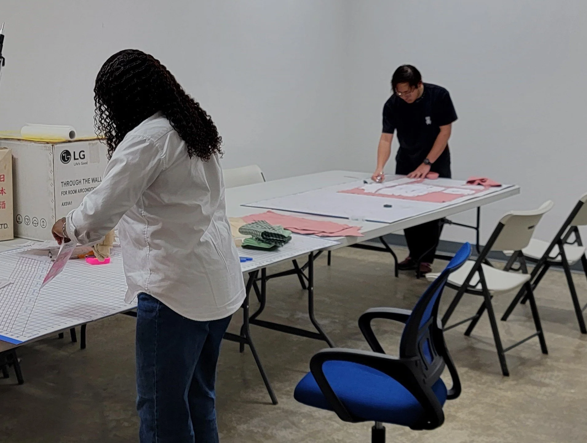 Kasandra and Wei cutting their next project.jpg