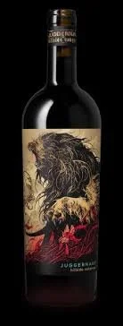 Bottle of Juggernaut wine with a label featuring a lion illustration in black, gold, and red colors.
