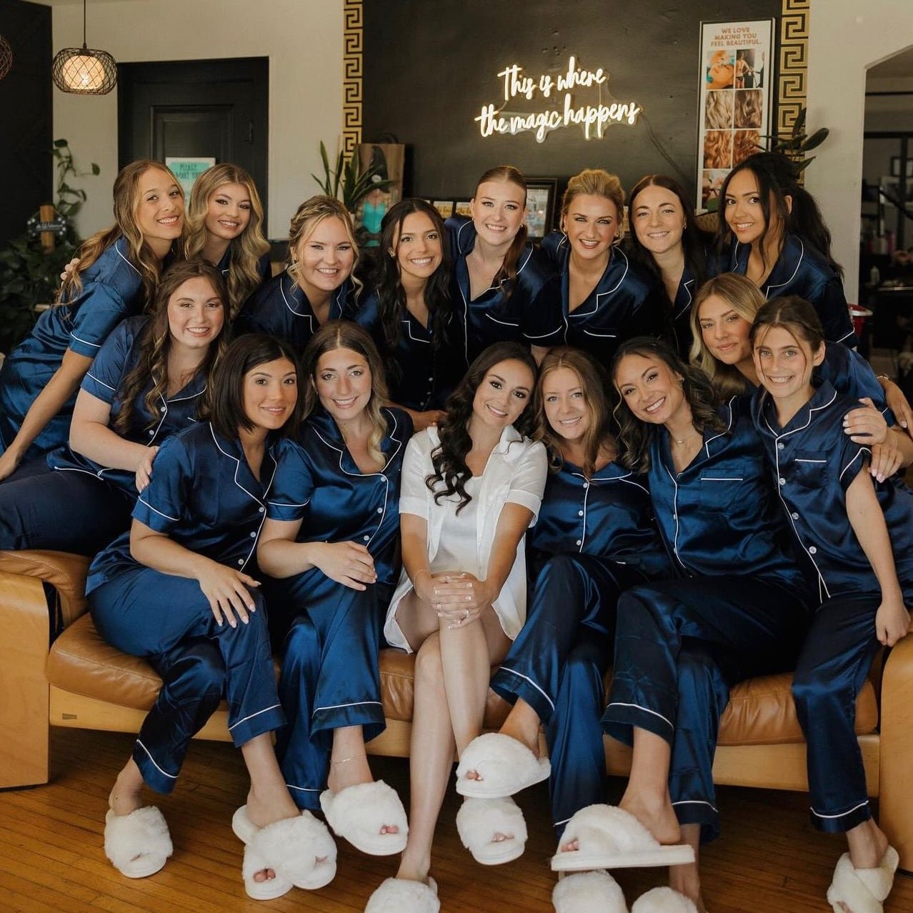 Bride and friends in matching pajamas gathered for a fun pre-wedding photo at One Salon & Bridal Co in St. Charles, IL