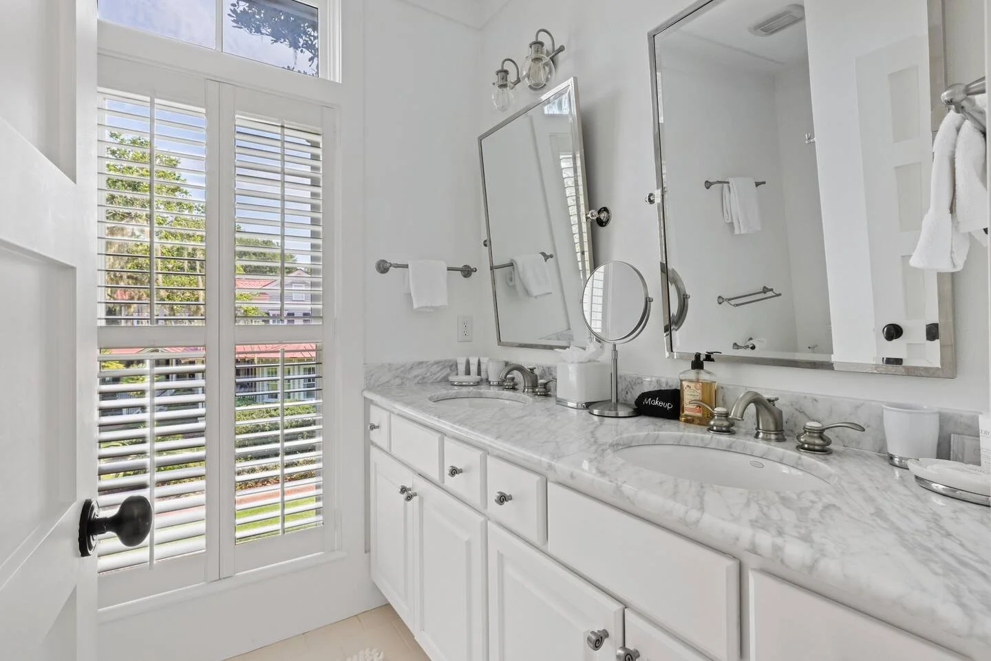 After: Bathroom - Modern mirrors and lights added.