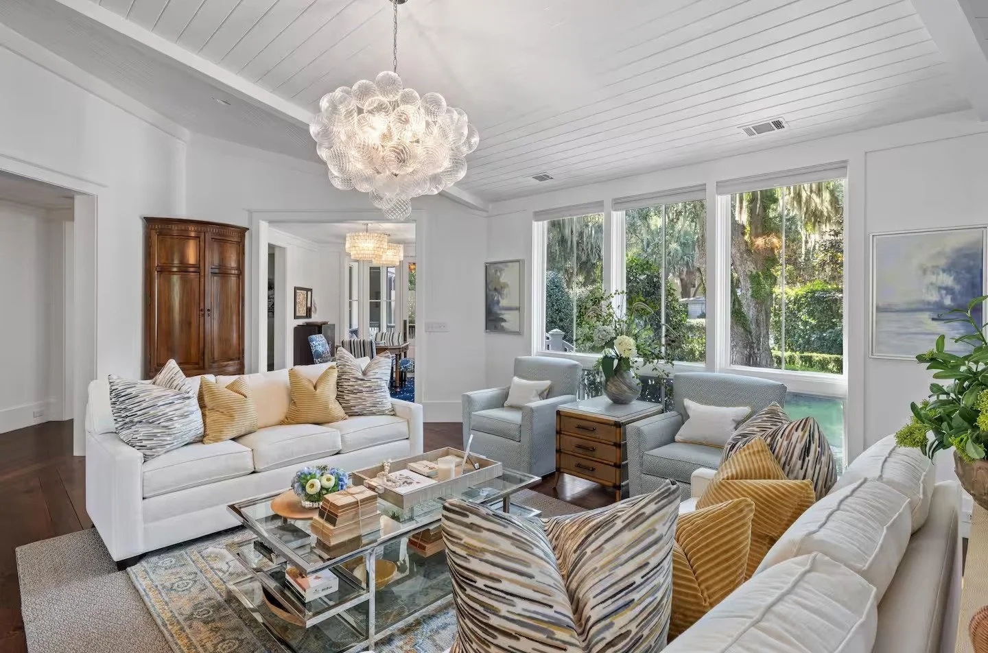 After: Living room, custom matching conversation sofa's and custom swivel chairs makes for easy entertaining.