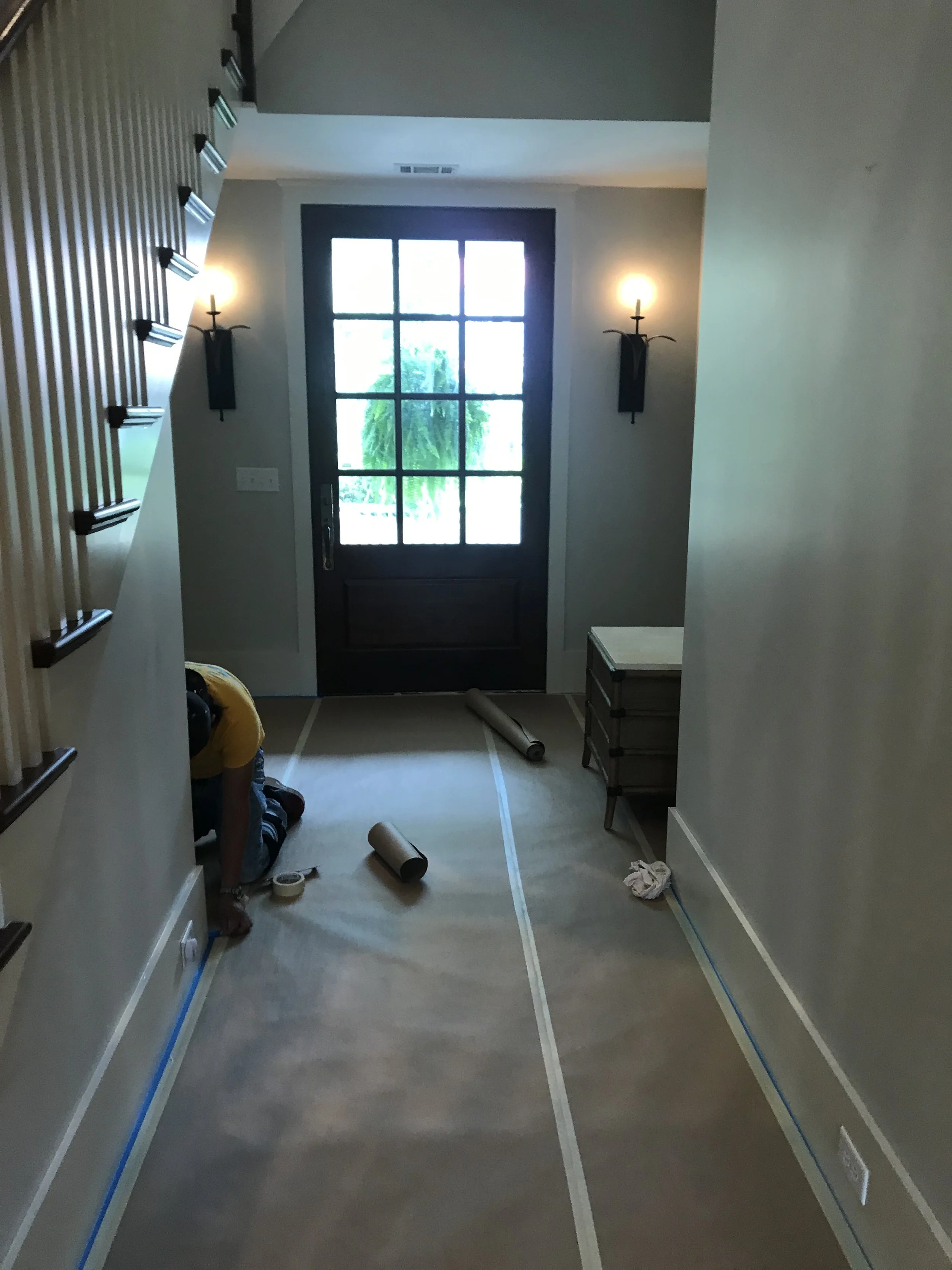 Before: Entryway - Needs fresh art and furniture.