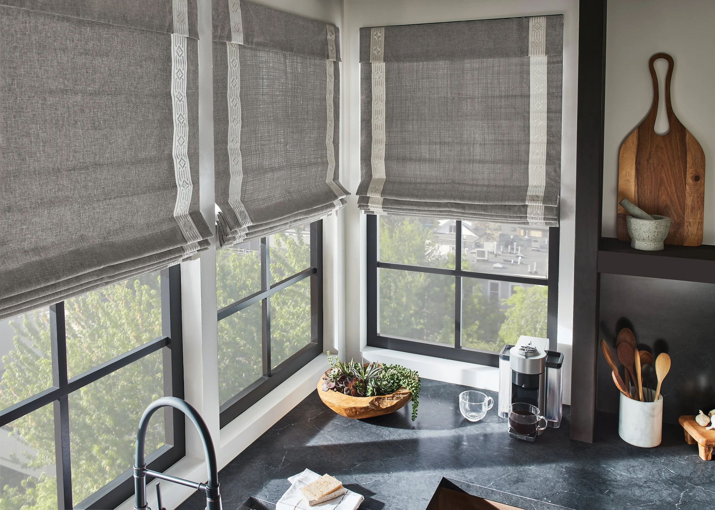 Relaxed Roman shades installed in a Tyler, TX dining room to create a casual, inviting atmosphere.