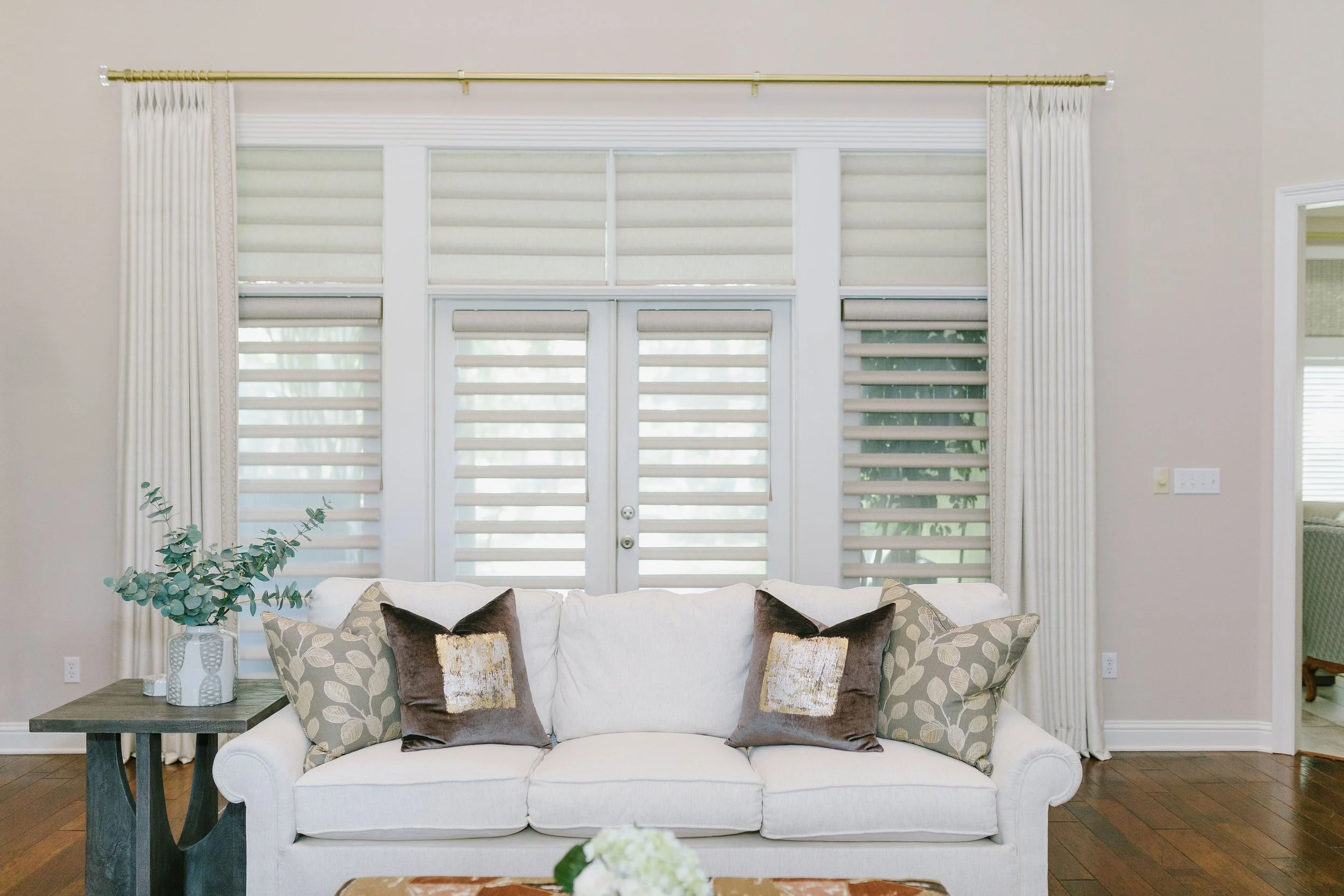 After:  Modern window shadings with sleek panels.