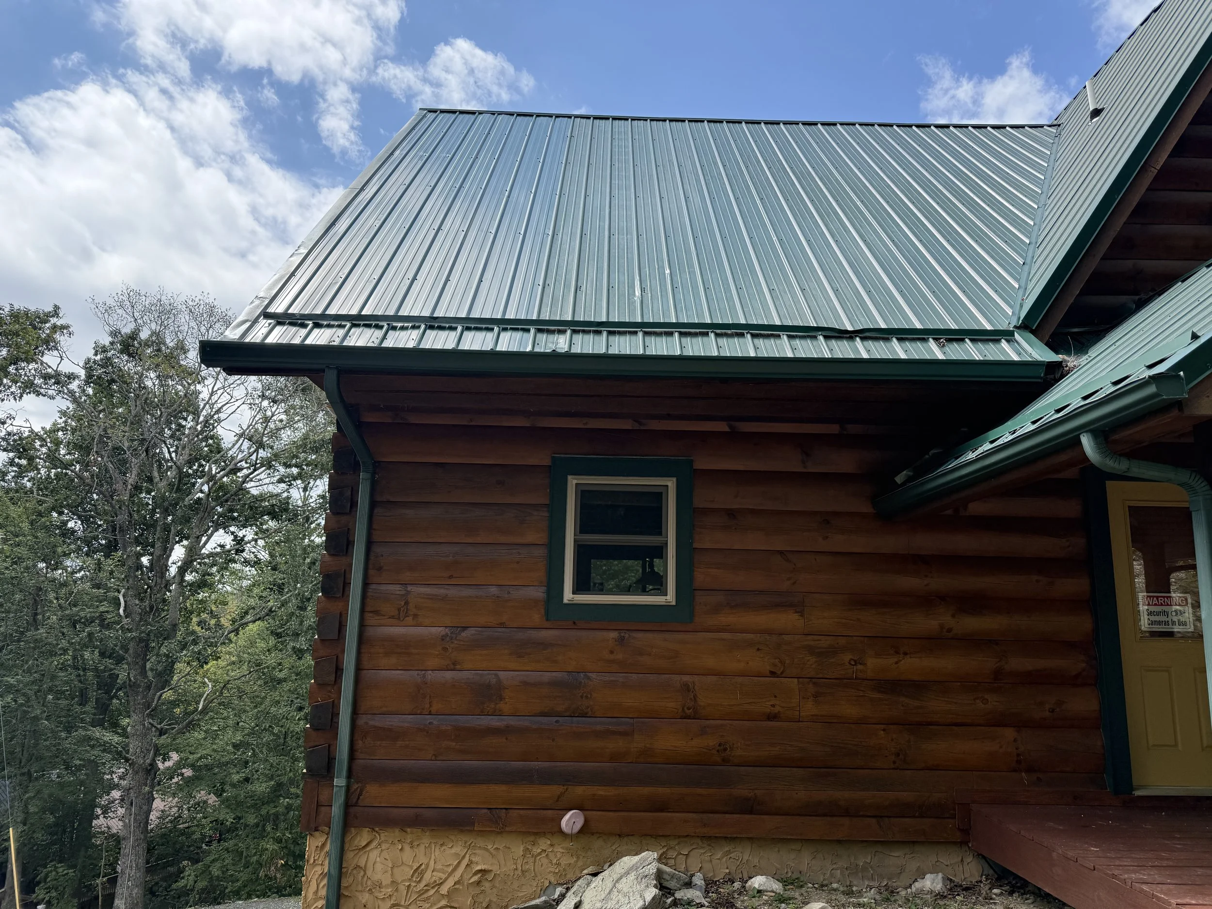 New green rib panel roof panels installed replacing storm damage from hurricane helene