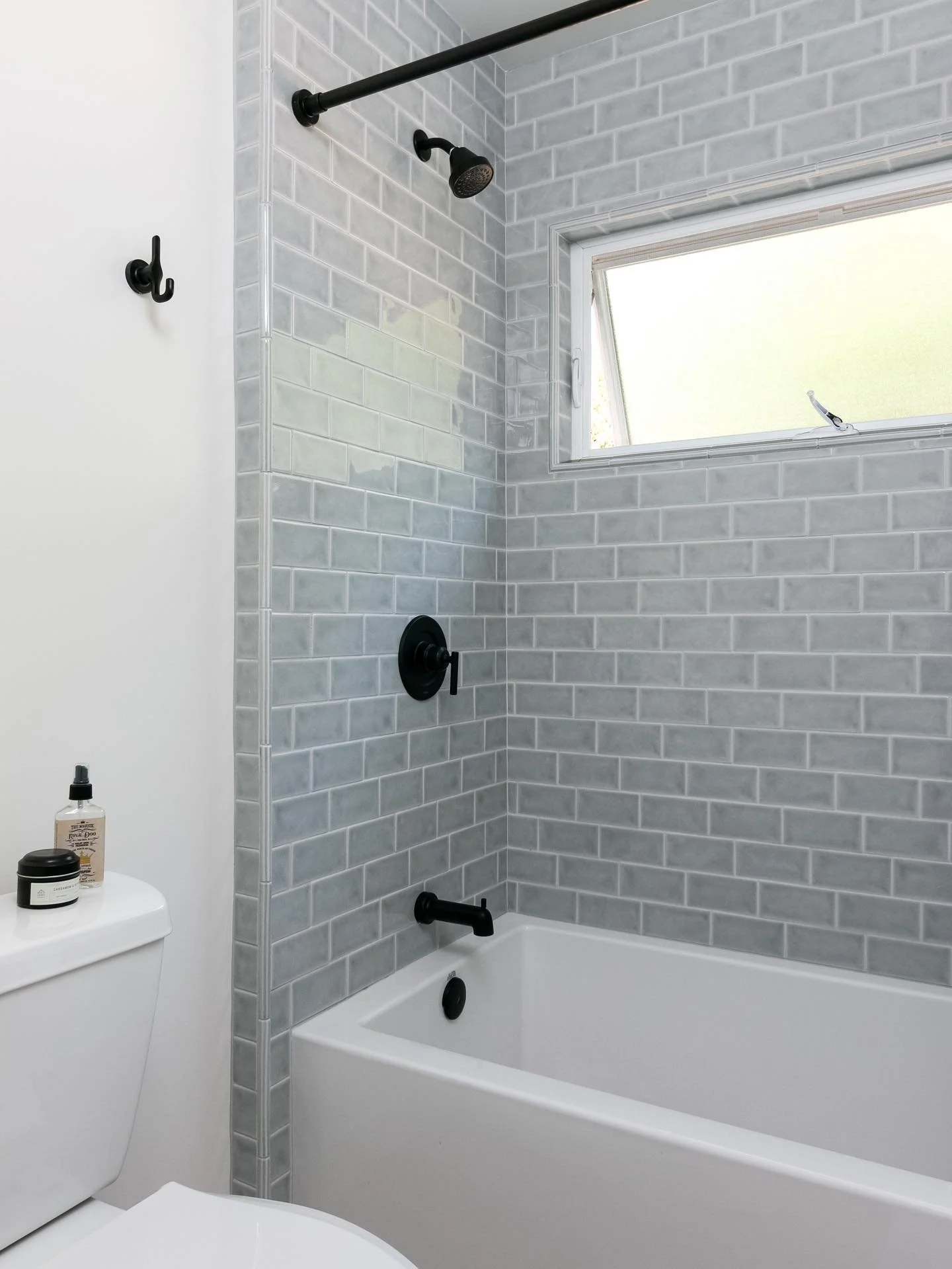 Clean lines and cool tones&mdash;this glossy subway tile brings a fresh, modern feel to a timeless bath. ✨