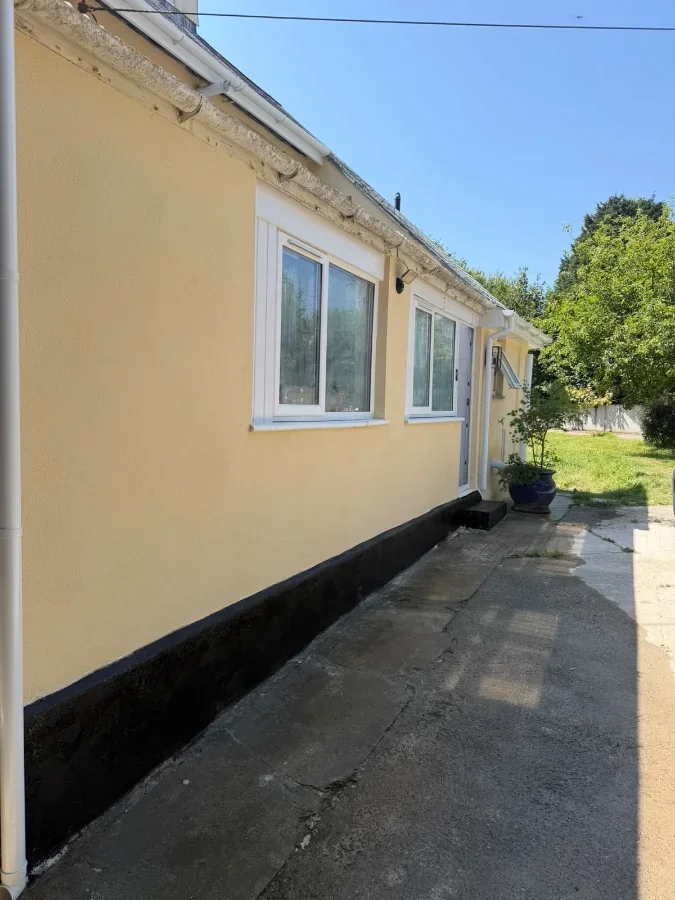 Before refurbishment image of a bungalow exterior